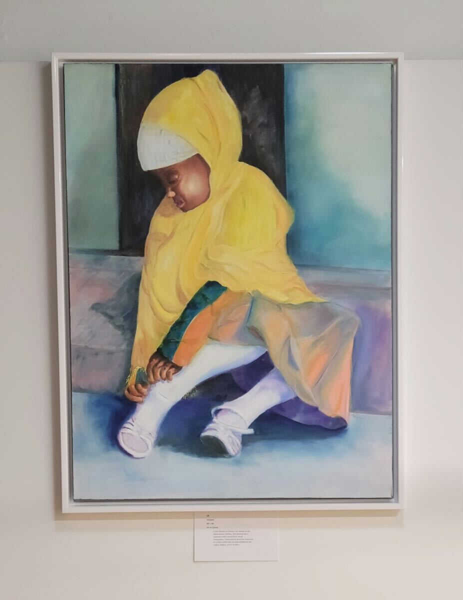 A painting of a Black girl fixing her shoes hangs on a wall in an art gallery.
