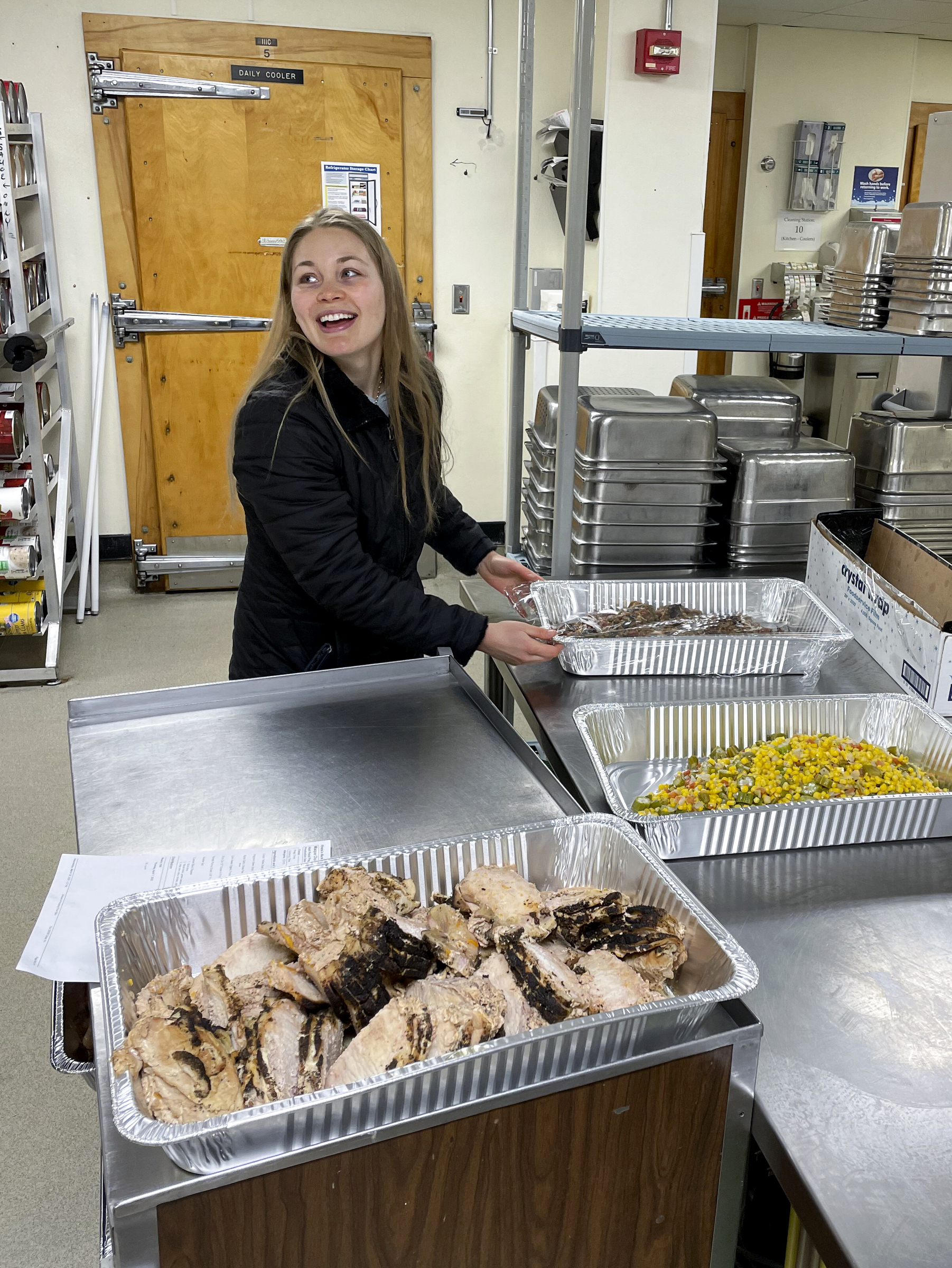 Morgan Barlin of the University of Wisconsin-Madison Food Recovery Network branch collects leftover food