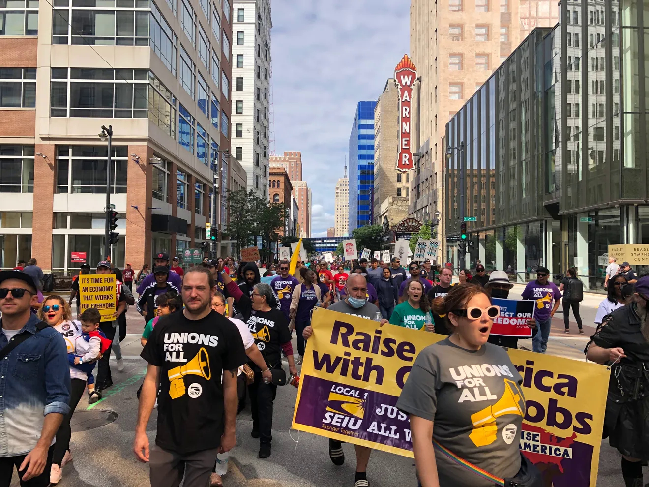 Hundreds of union members and workers at a Labor Day event march