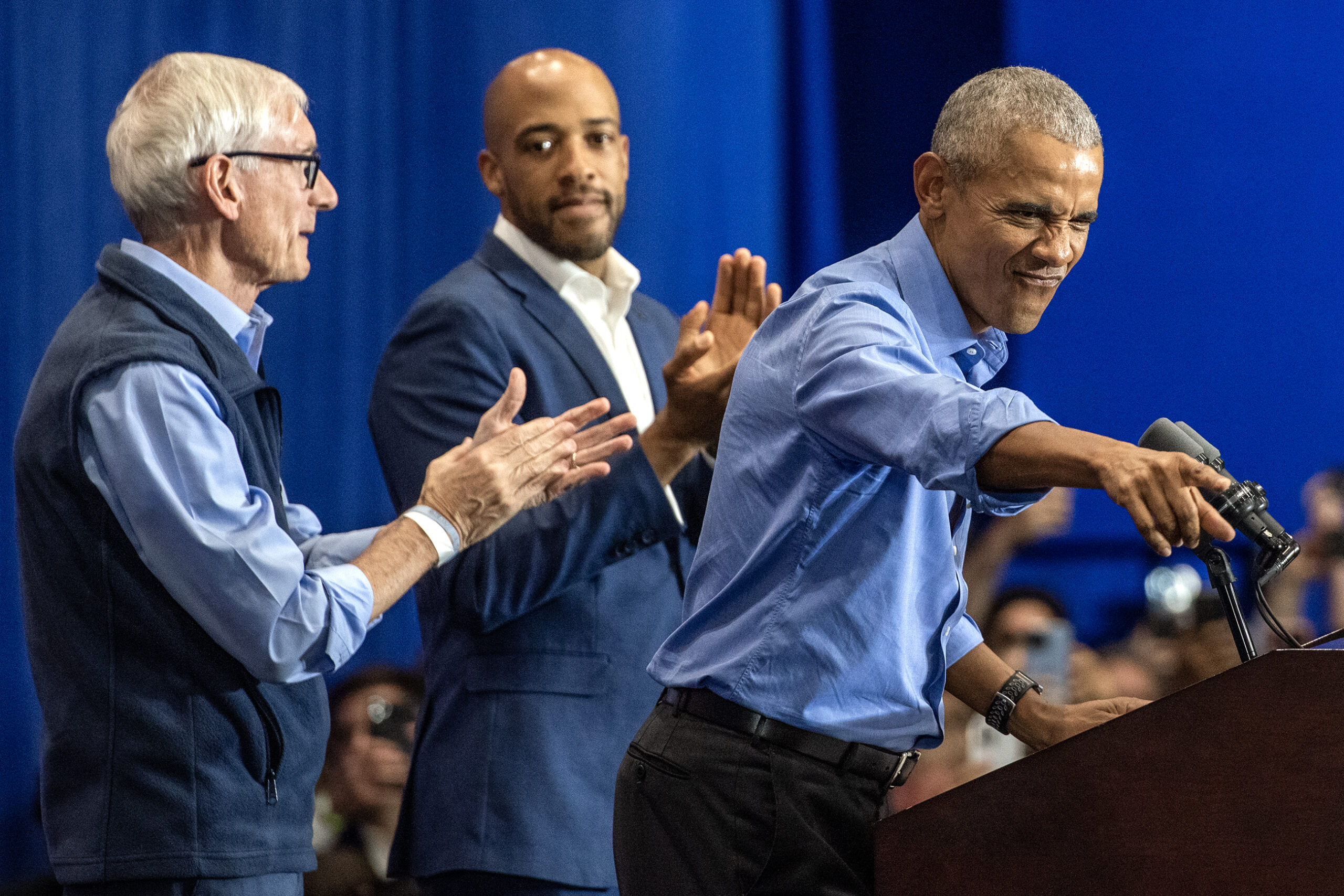 Former President Barack Obama points from the podium.