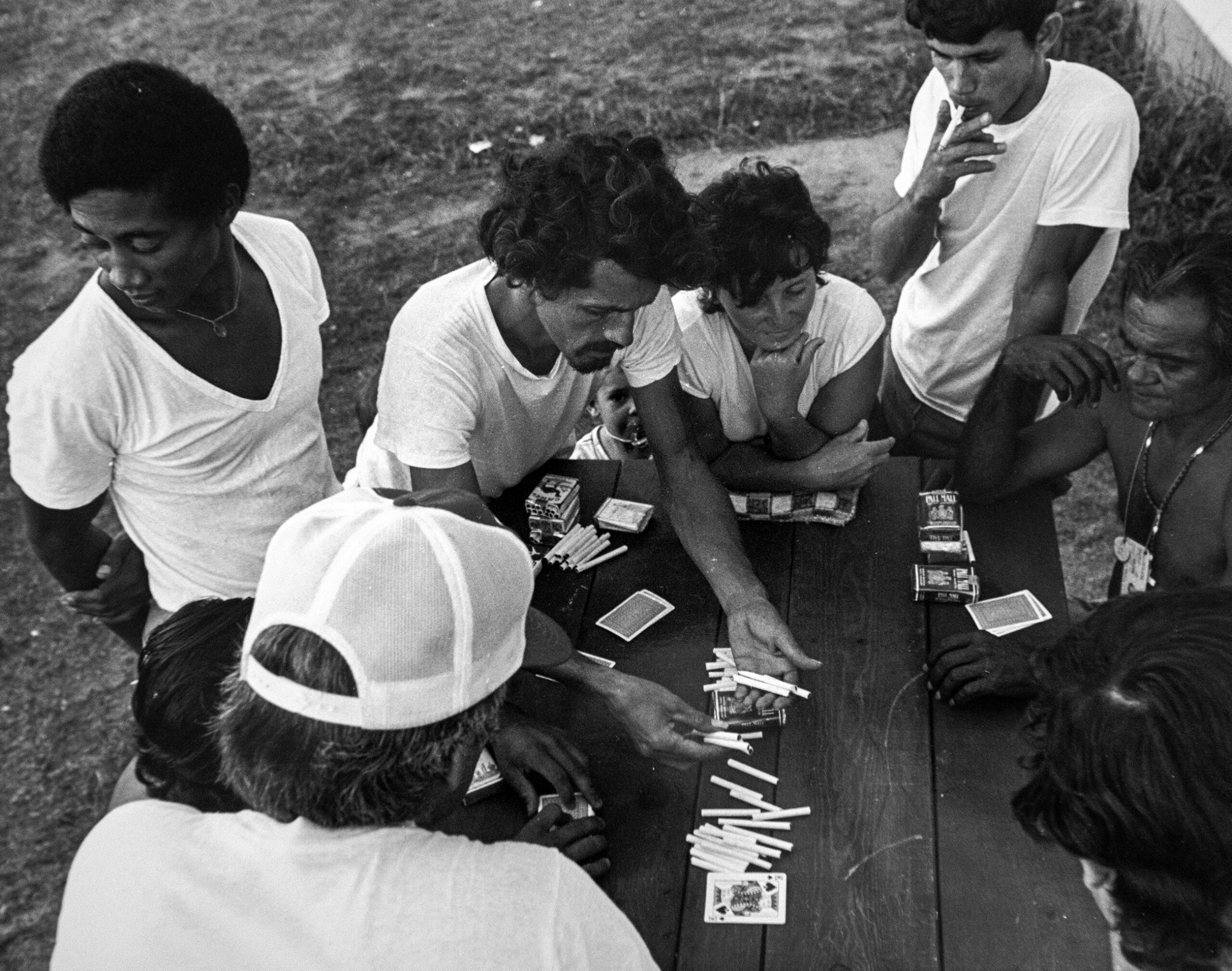 Cuban refugees at Fort McCoy in 1980 play cards and gamble for cigarettes