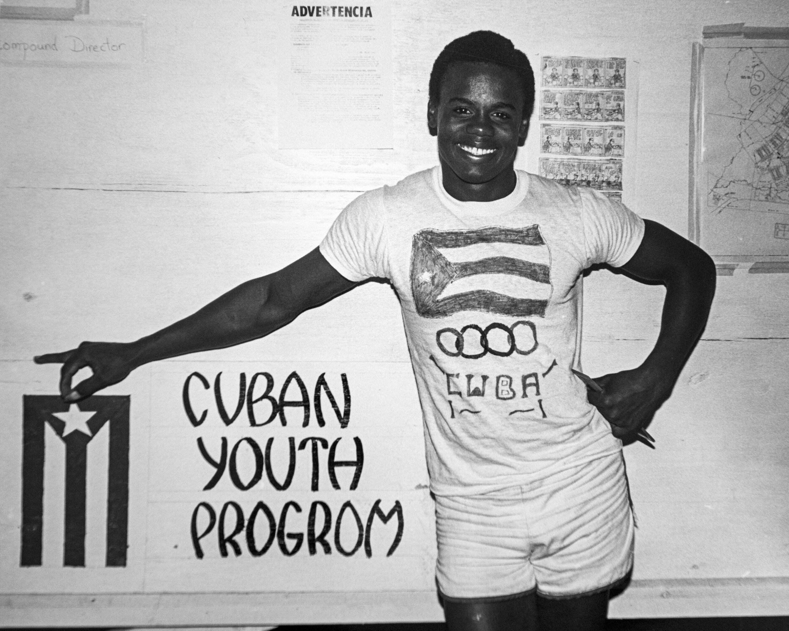 Leandro De Armas-Rodriguez displays his hand-painted t-shirt with the emblem of the Cuban Youth Program on it