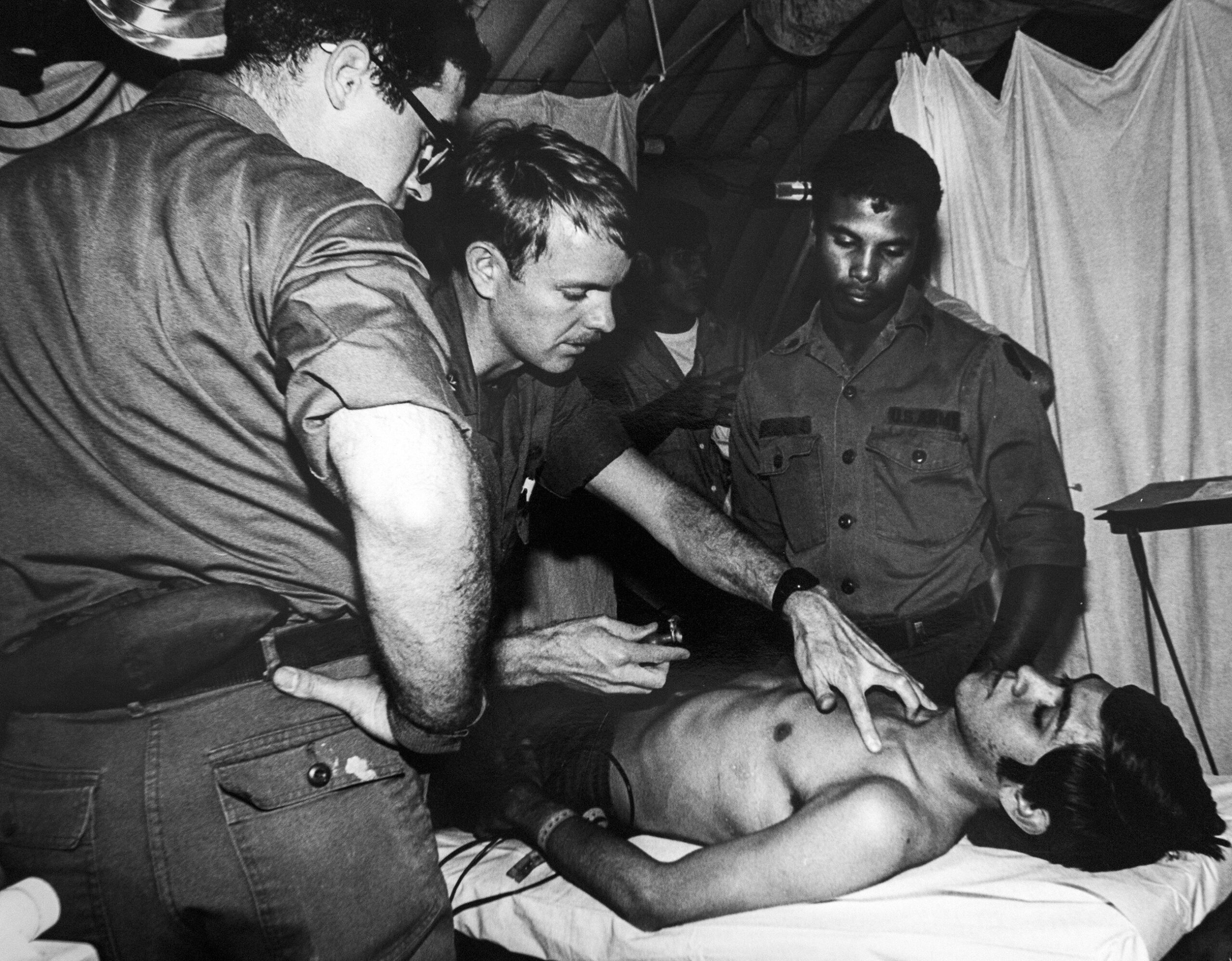 A Cuban refugee is examined by a doctor