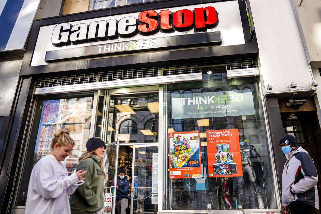 Pedestrians pass a GameStop store on 14th Street at Union Square in the Manhattan, New York