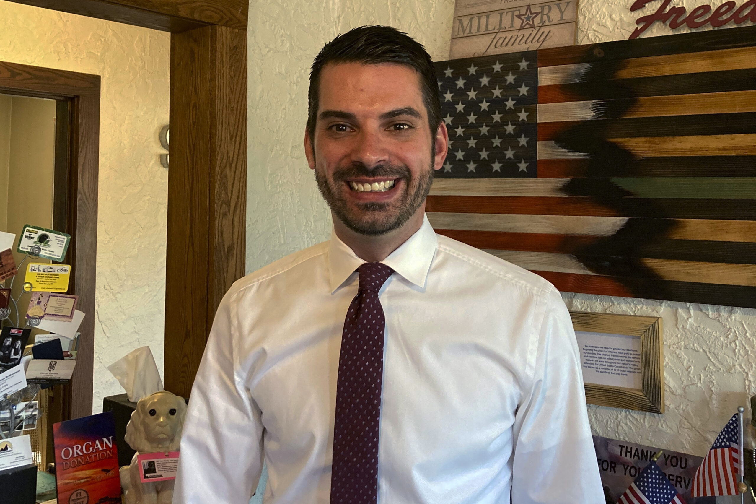 Wisconsin GOP attorney general hopeful Eric Toney poses at the Stone Oak Coffee Haus