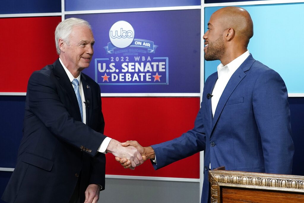 U.S. Sen. Ron Johnson, R-Wis., left, and his Democratic challenger Mandela Barnes shake hands before a televised debate