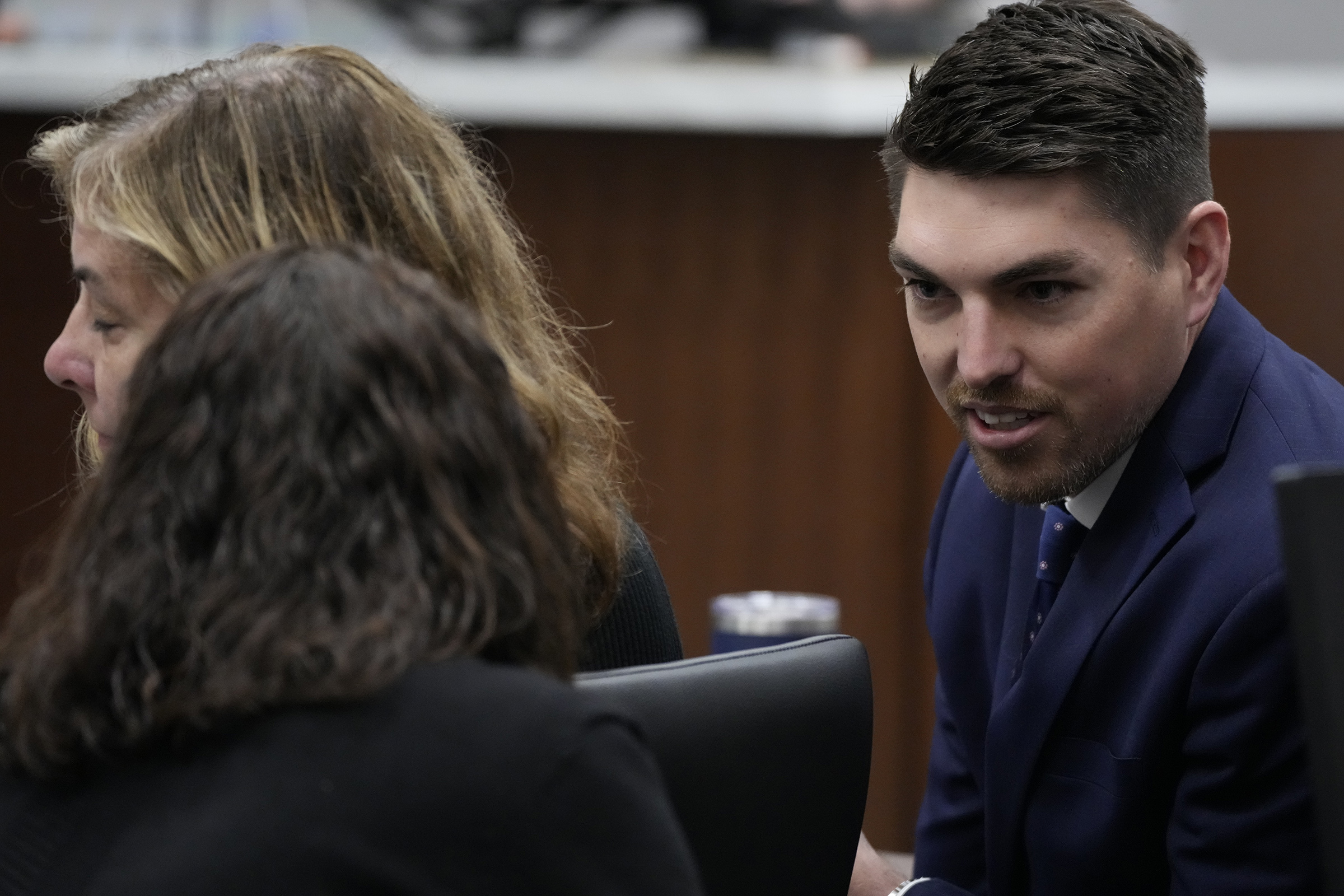 Waukesha Assistant District Attorney, Zach Wittchow, right, talks with Waukesha County district attorney Susan Opper