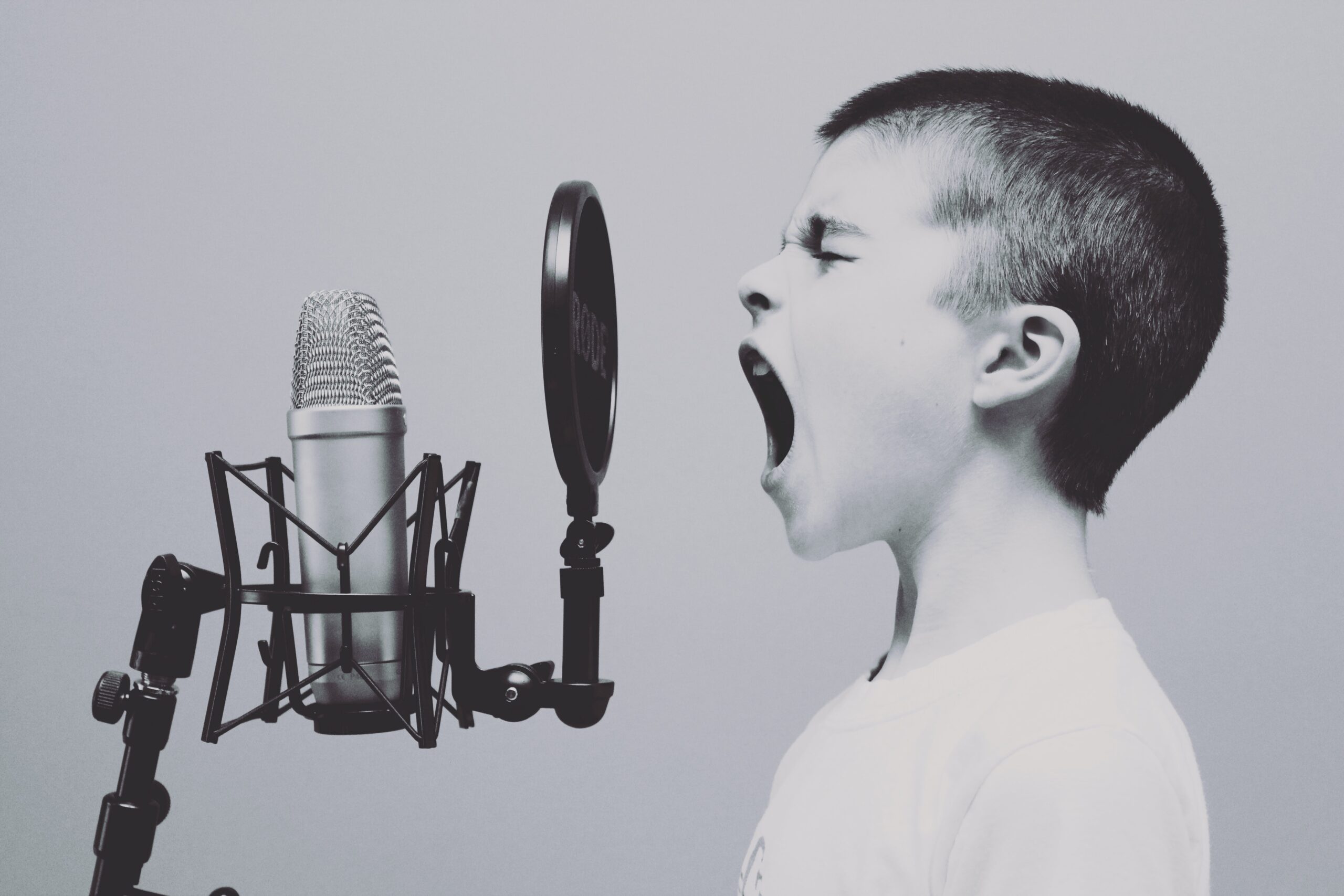 A child singing into a microphone