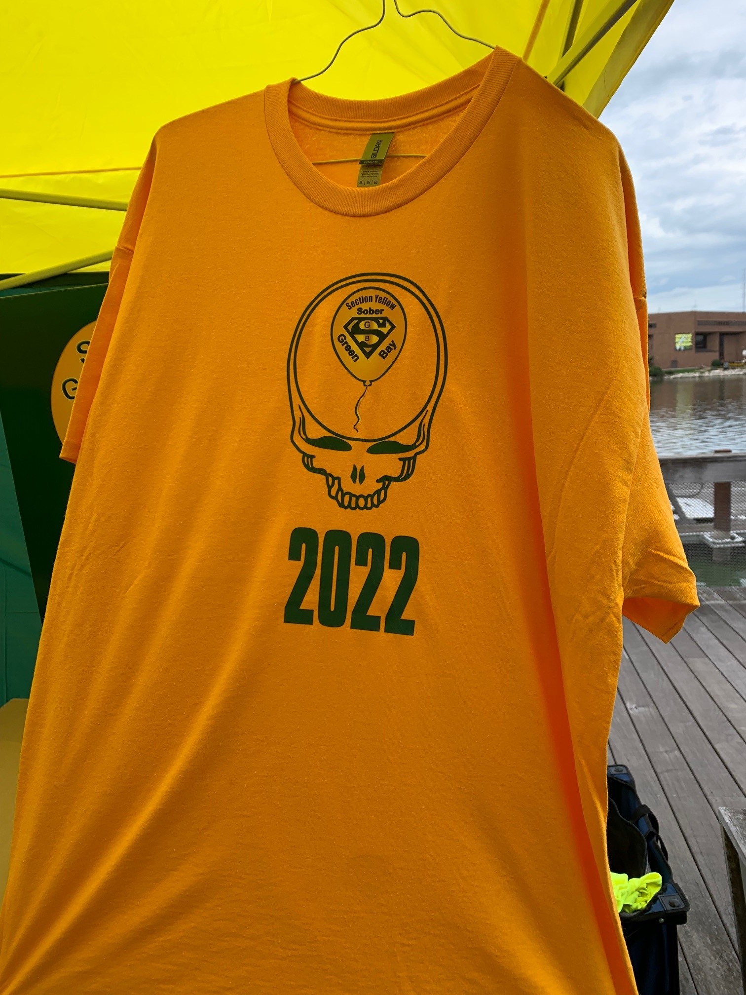 A Yellow T-shirt with the skull design of the Grateful Dead