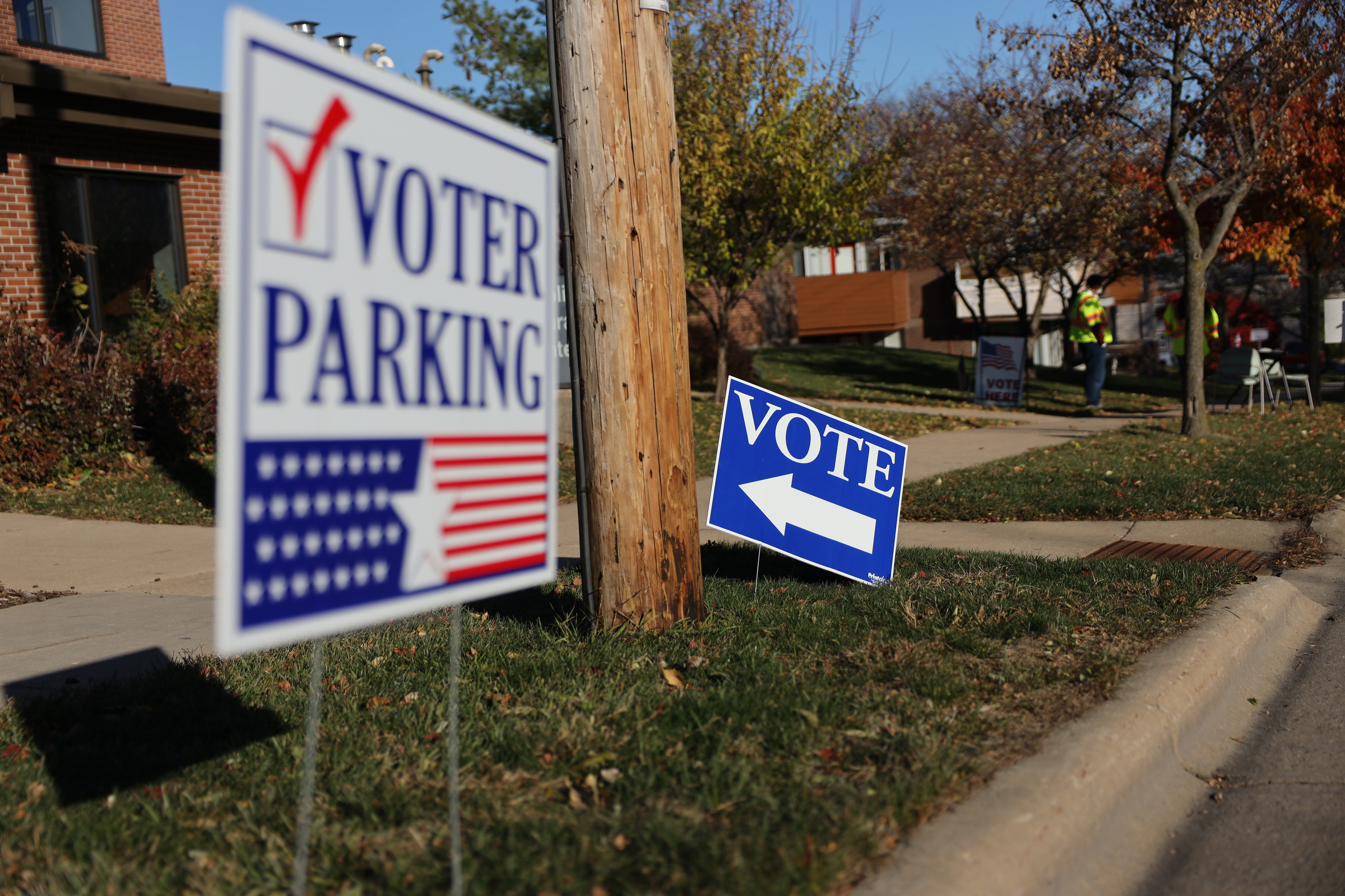 Voting signs are seen outside the polling place at the Catholic Multicultural Center in Madison