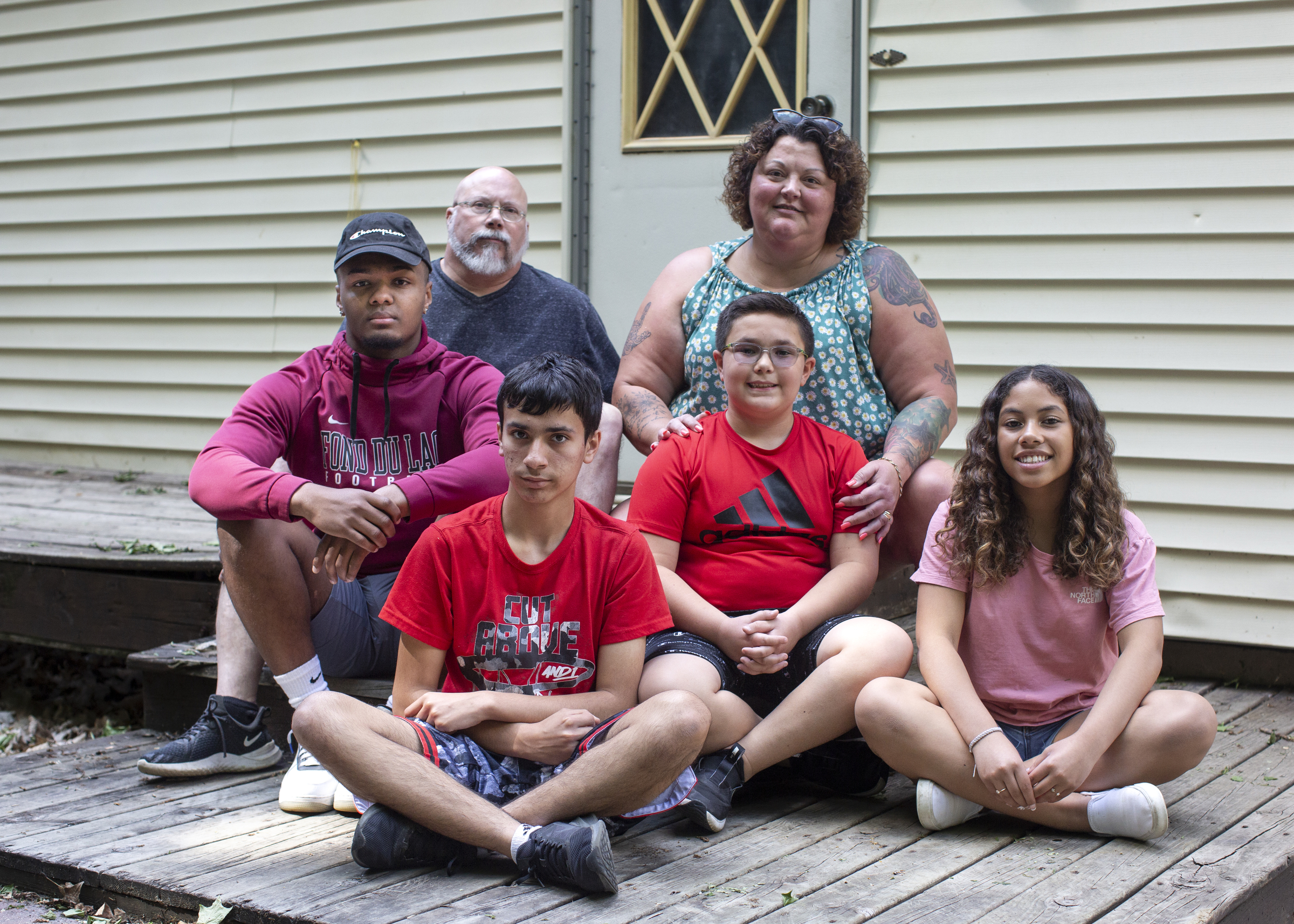 Amy and Dan Wempner pose at their home with their children