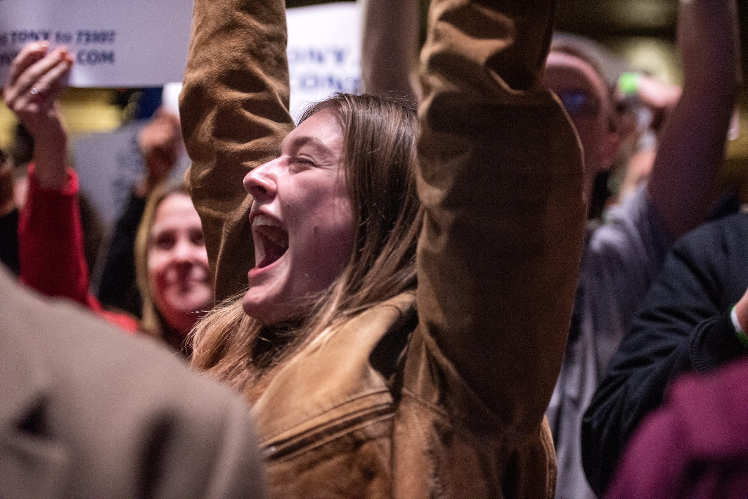 A woman screams with excitement.