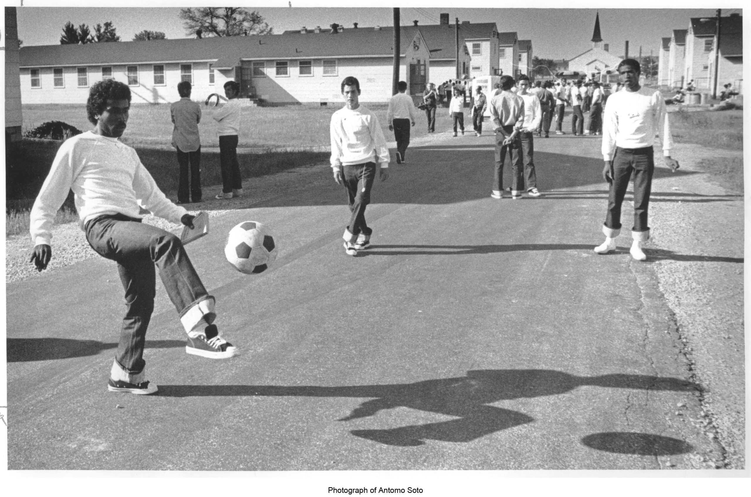 A black and white photograph of Cuban refugees playing soccer