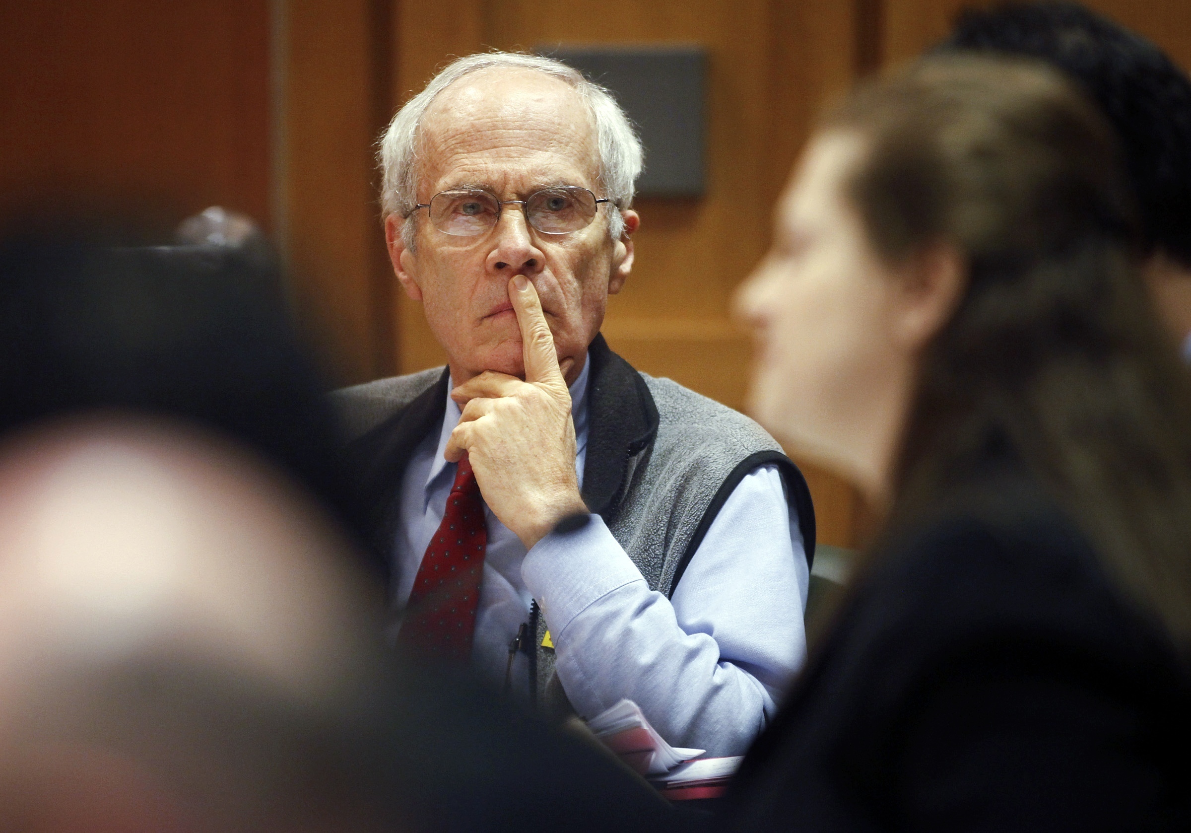 Wisconsin Secretary of State Doug La Follette listens to Assistant Attorney General Maria Lazar