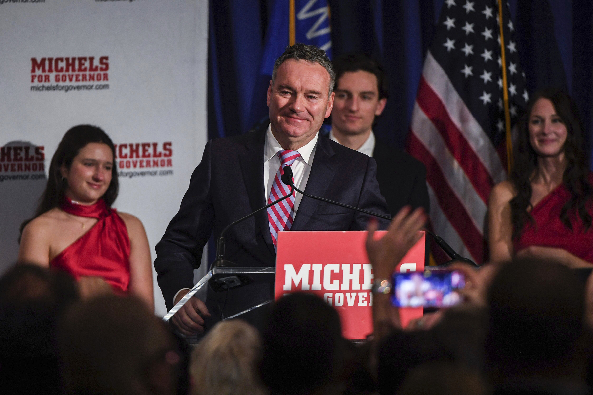 Wisconsin Republican gubernatorial candidate Tim Michels makes his way to the podium to address his supporters