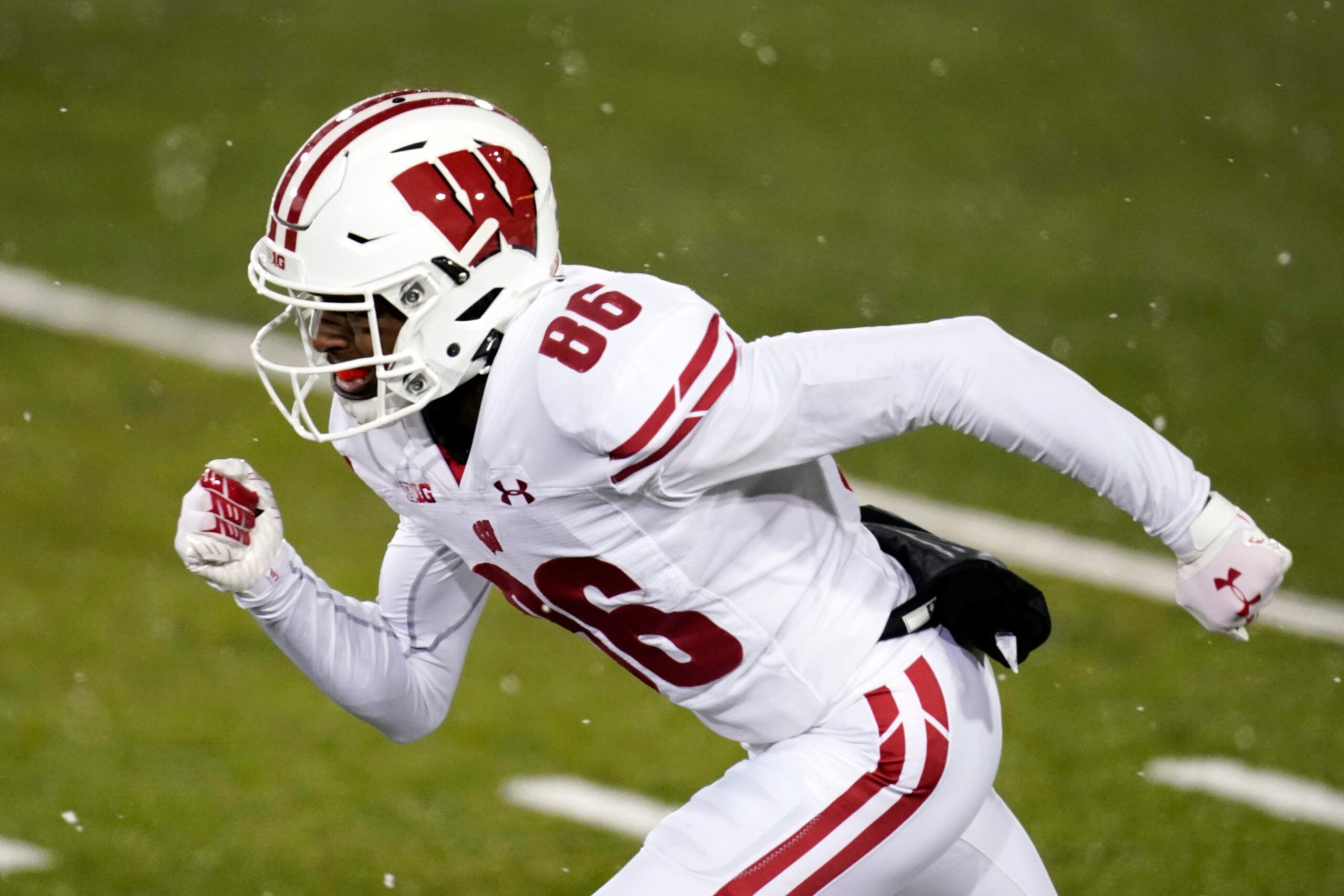 Wisconsin wide receiver Devin Chandler runs up field