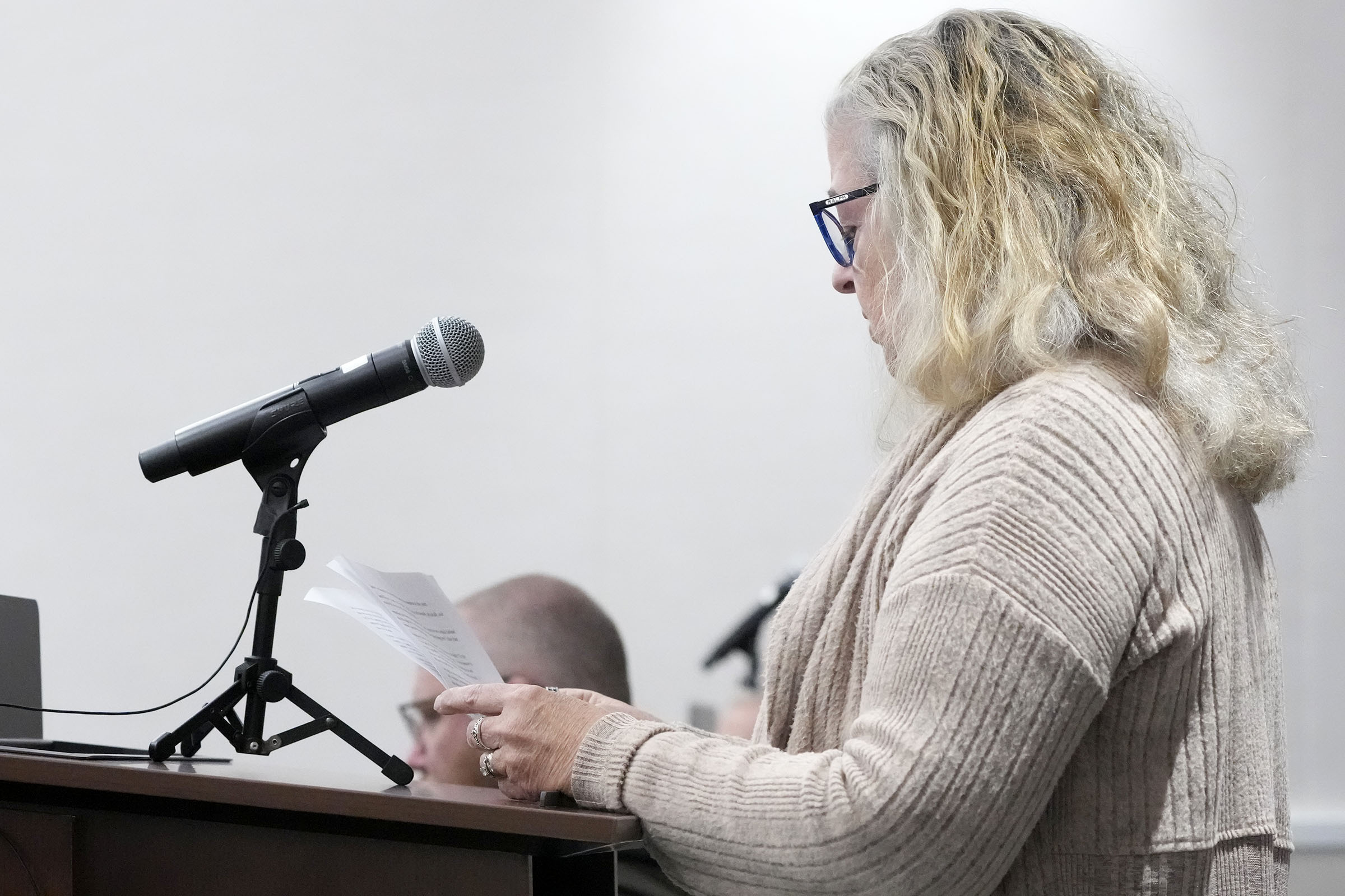 Margaret Pachulis, who was injured marching with a group with the Catholic Community of Waukesha, reads a statement