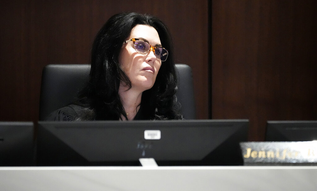 Waukesha County Circuit Court Judge Jennifer Dorow listens as Darrell Brooks gives his closing remarks during his sentencing in a Waukesha County Circuit Court