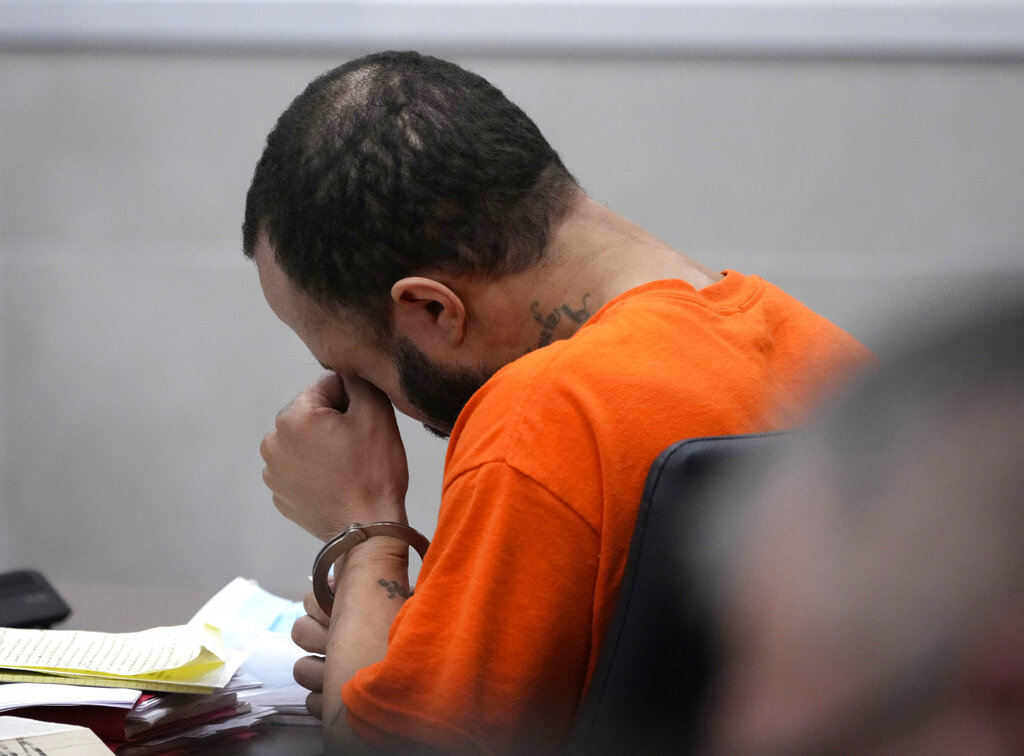 Darrell Brooks reacts as Michele Allworth gives a victim impact statement on Brooks' behalf during Brooks' sentencing in a Waukesha County Circuit Court