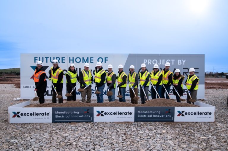 Officials from Excellerate participate in a groundbreaking ceremony.