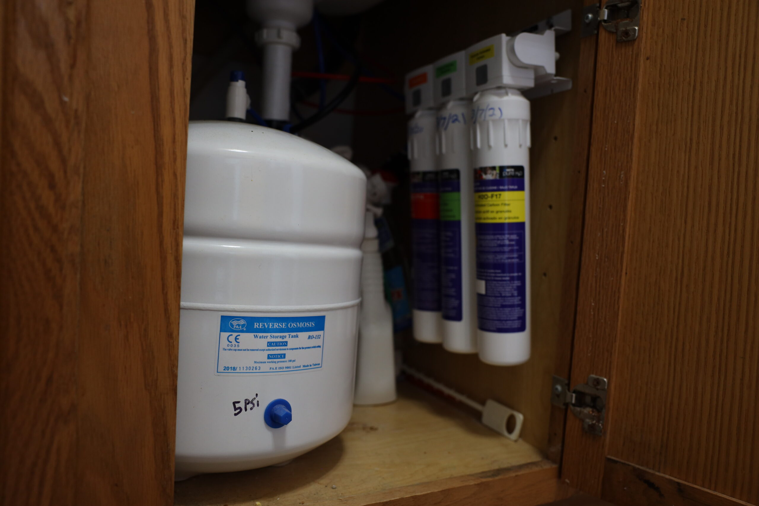 A reverse osmosis filtration system is seen under the kitchen sink of town of Campbell