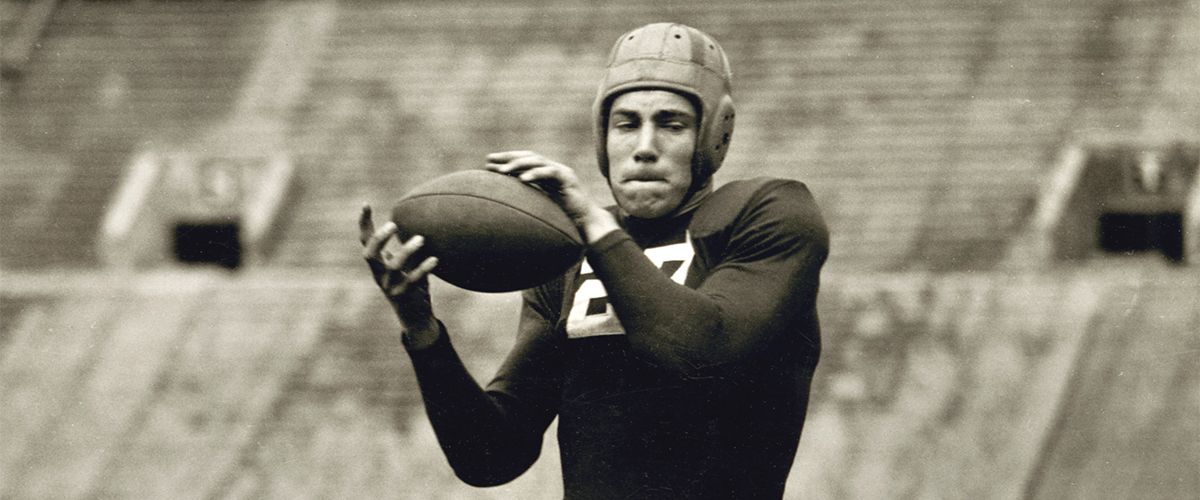 Football player Dave Schreiner recieves a pass