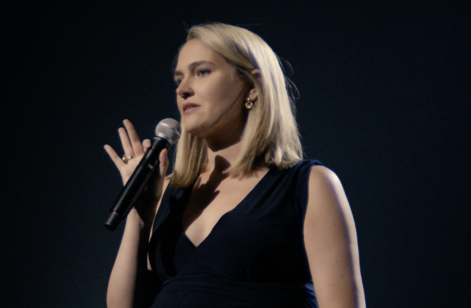Comedian Jena Friedman on stage in her Peacock stand-up comedy special, "Ladykiller"