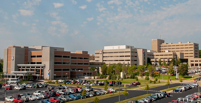The outside of Marshfield Medical Center-Marshfield, with cars in the parking lot