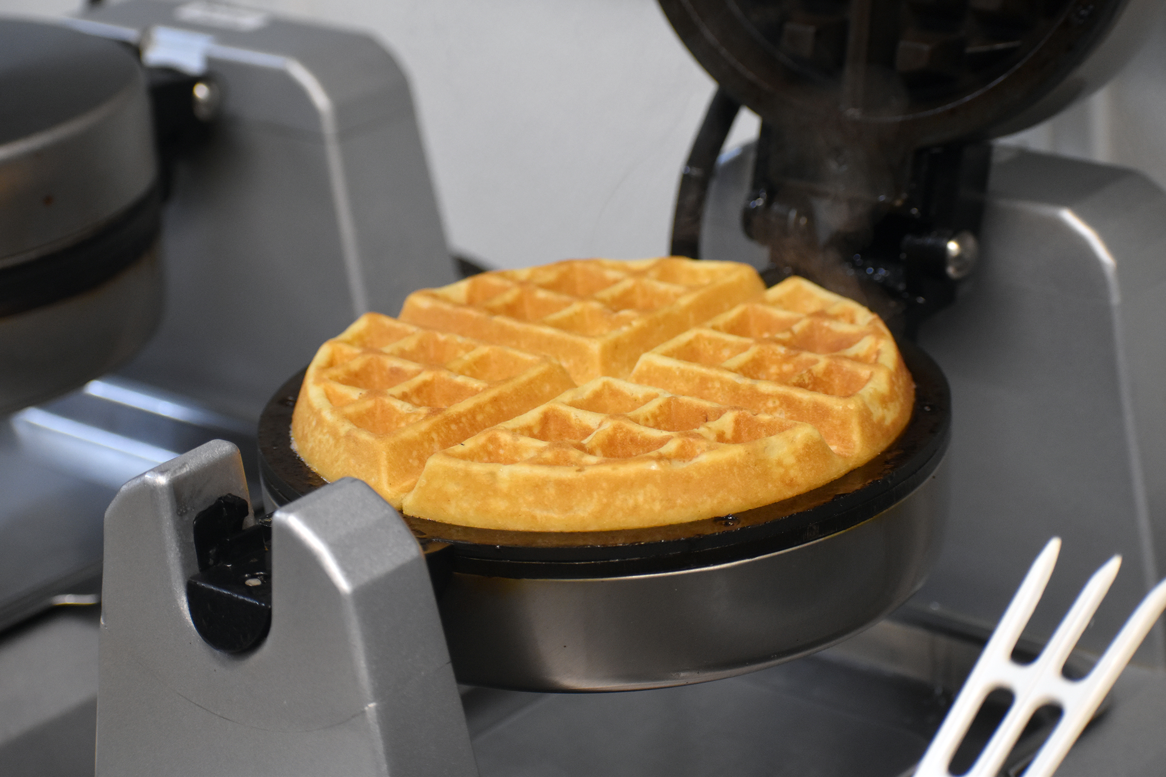 Waffle sizzles on waffle iron