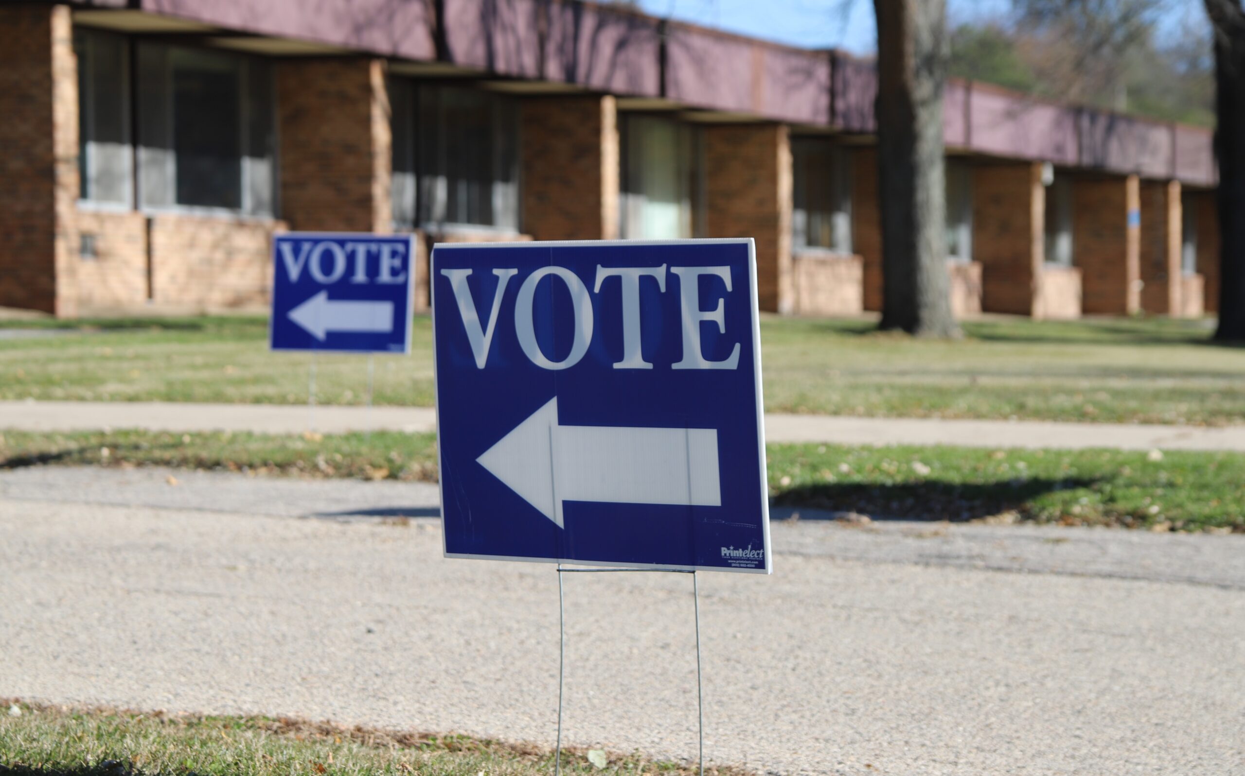 Signs showing voters where to enter the Blackhawk Middle School polling place on Madison's north side
