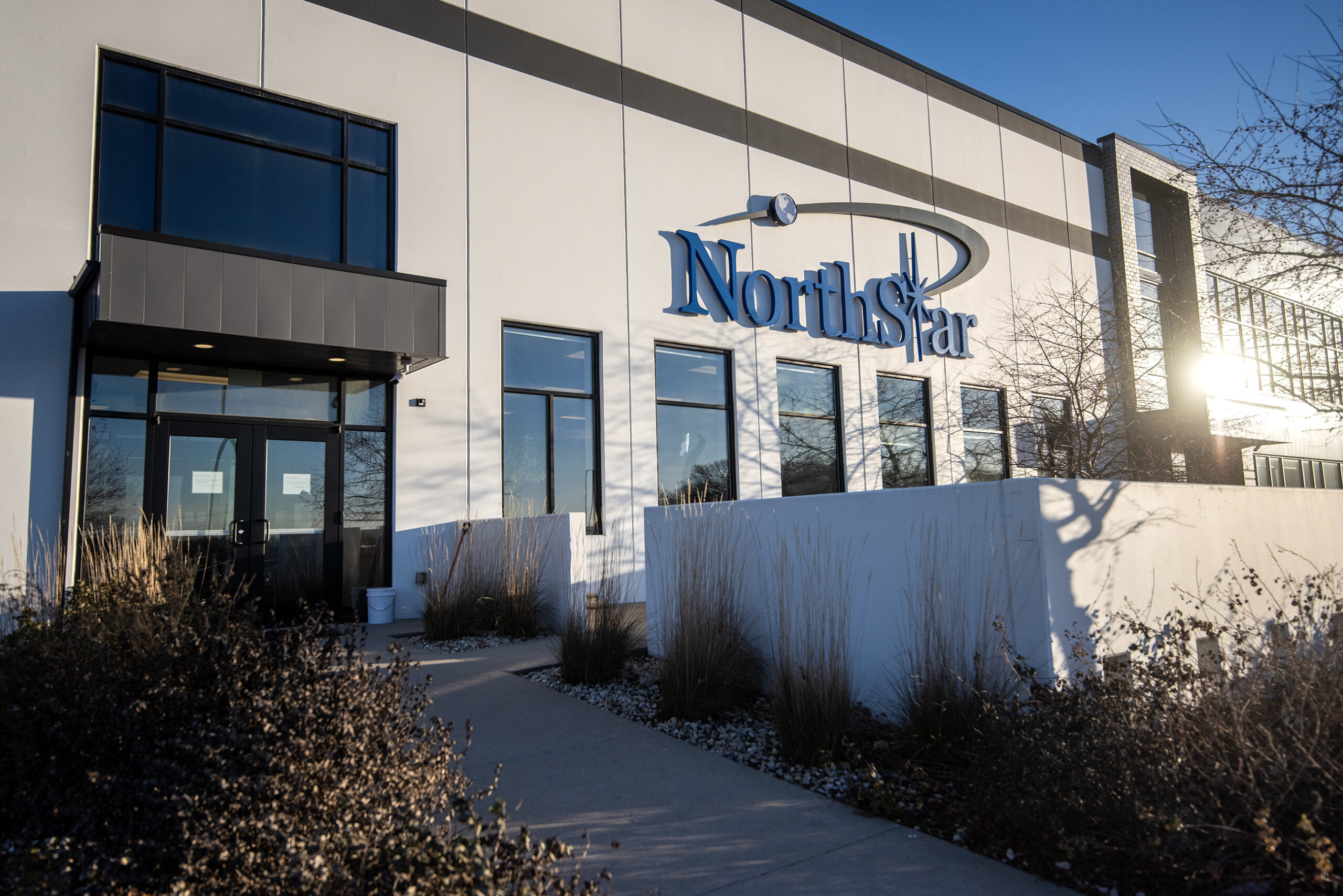 A building with an off-white exterior has a sign that says "NorthStar" on the front.