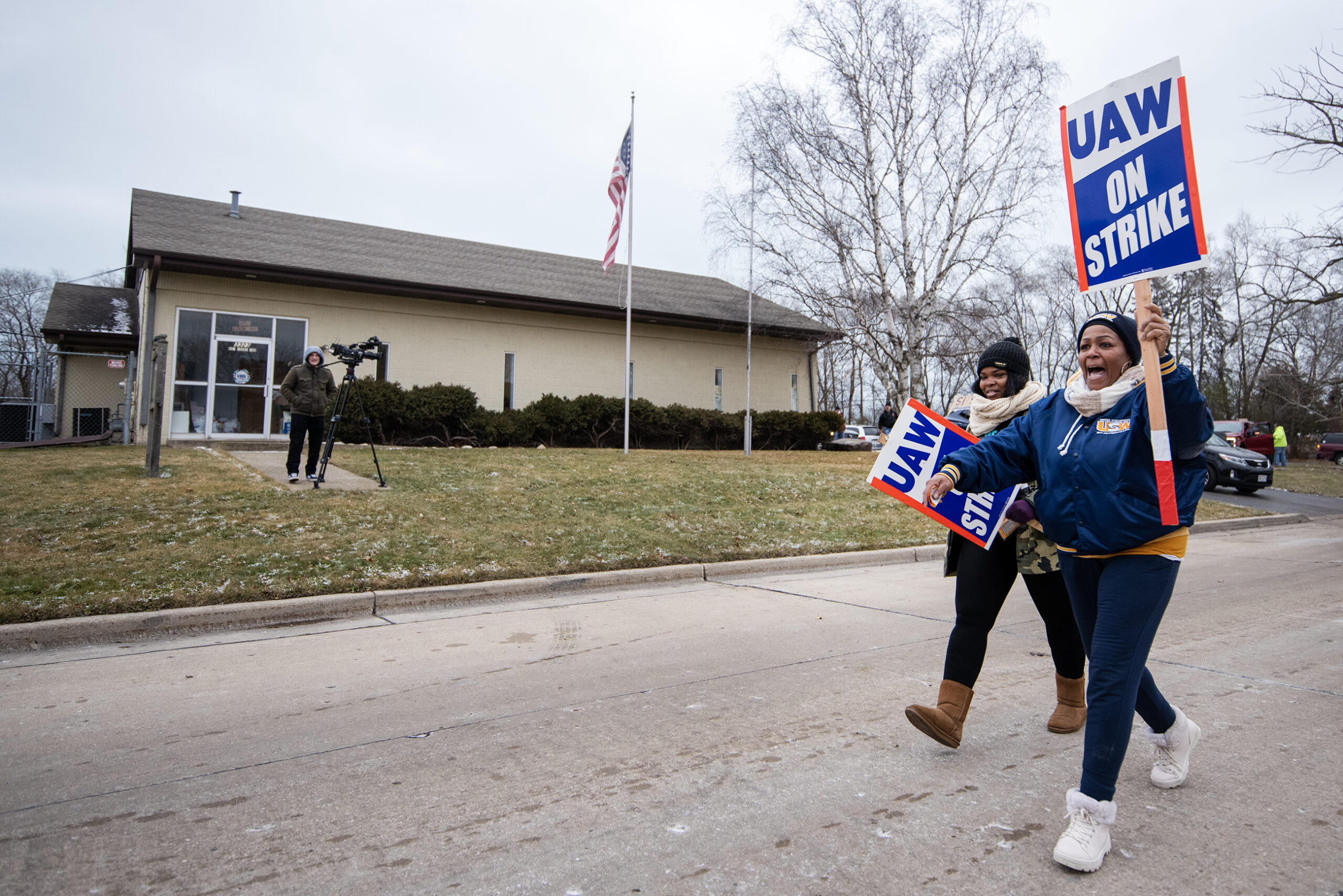 Two women with signs that say 