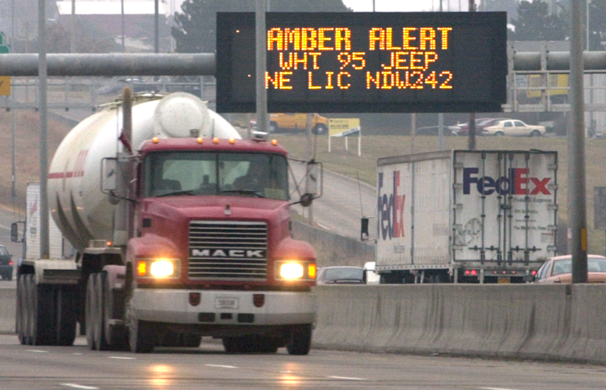 Electronic signs flash with an amber alert over Interstate 80 in Omaha, Neb.