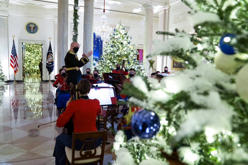 A Marine band plays Christmas music in the Grand Foyer of the White House during a press preview of the White House holiday decorations