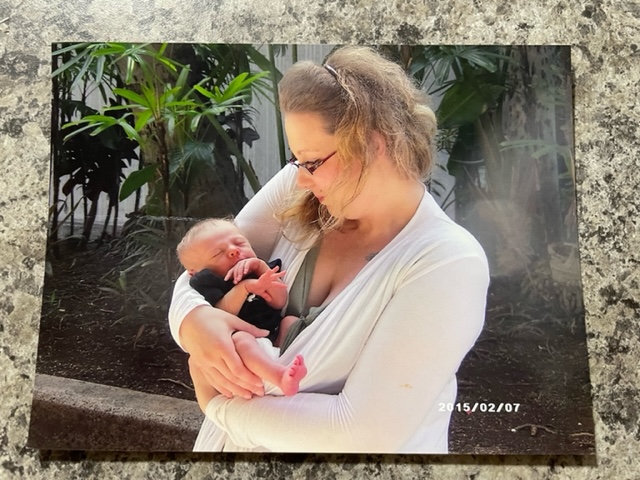 Tamara Loertscher holds her son, Harmonious Ellner, weeks after his birth in 2015