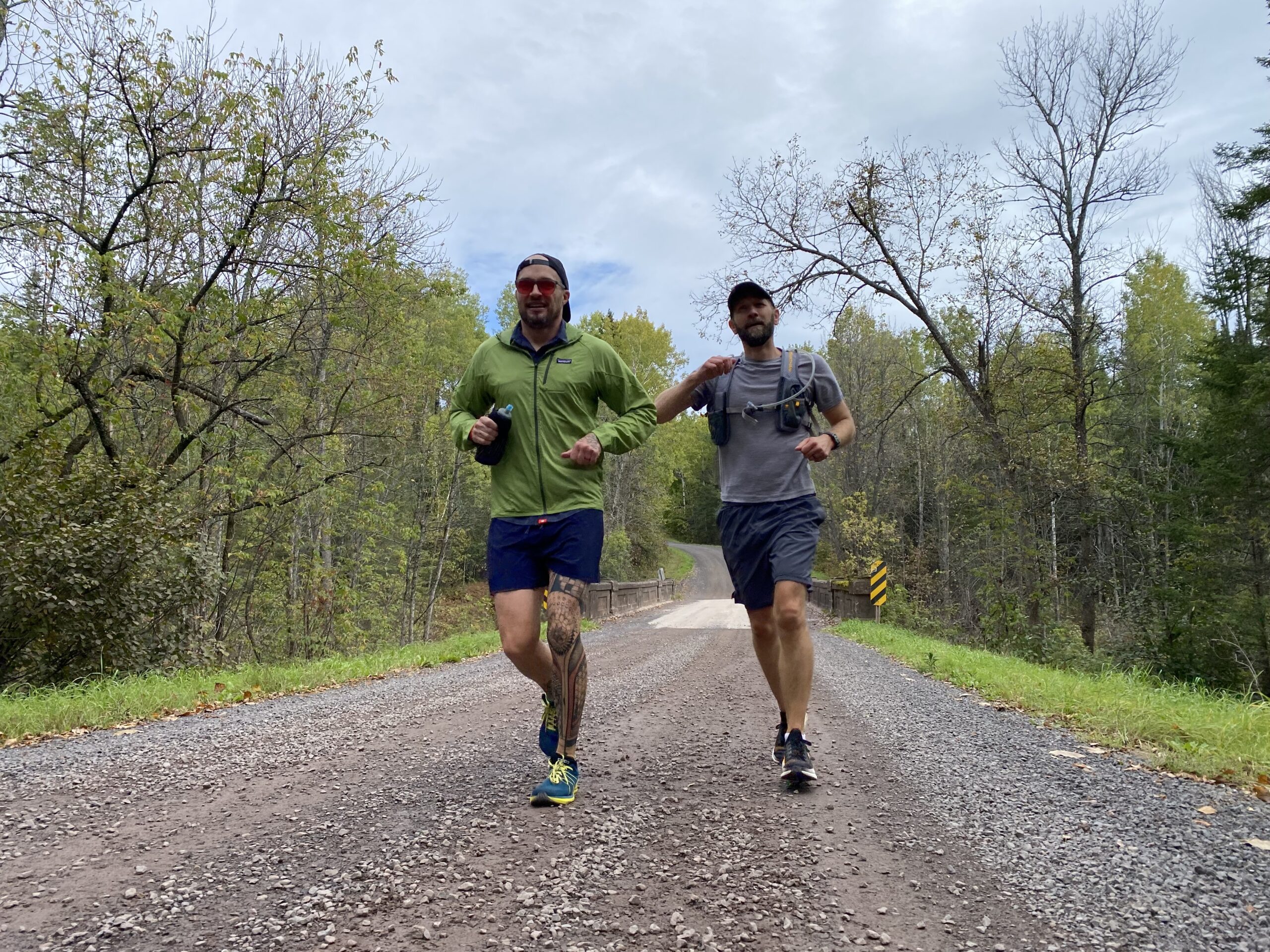 Brad Birkel, left, and crew member Matt Lawler run a road section of the North Country Trail