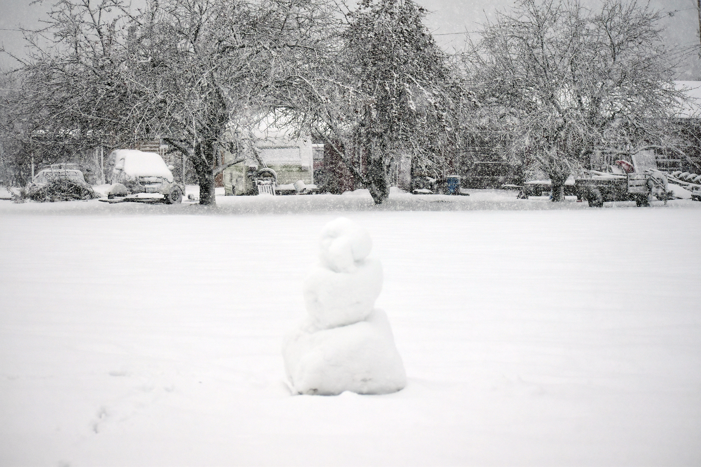 Snowman amid the snow