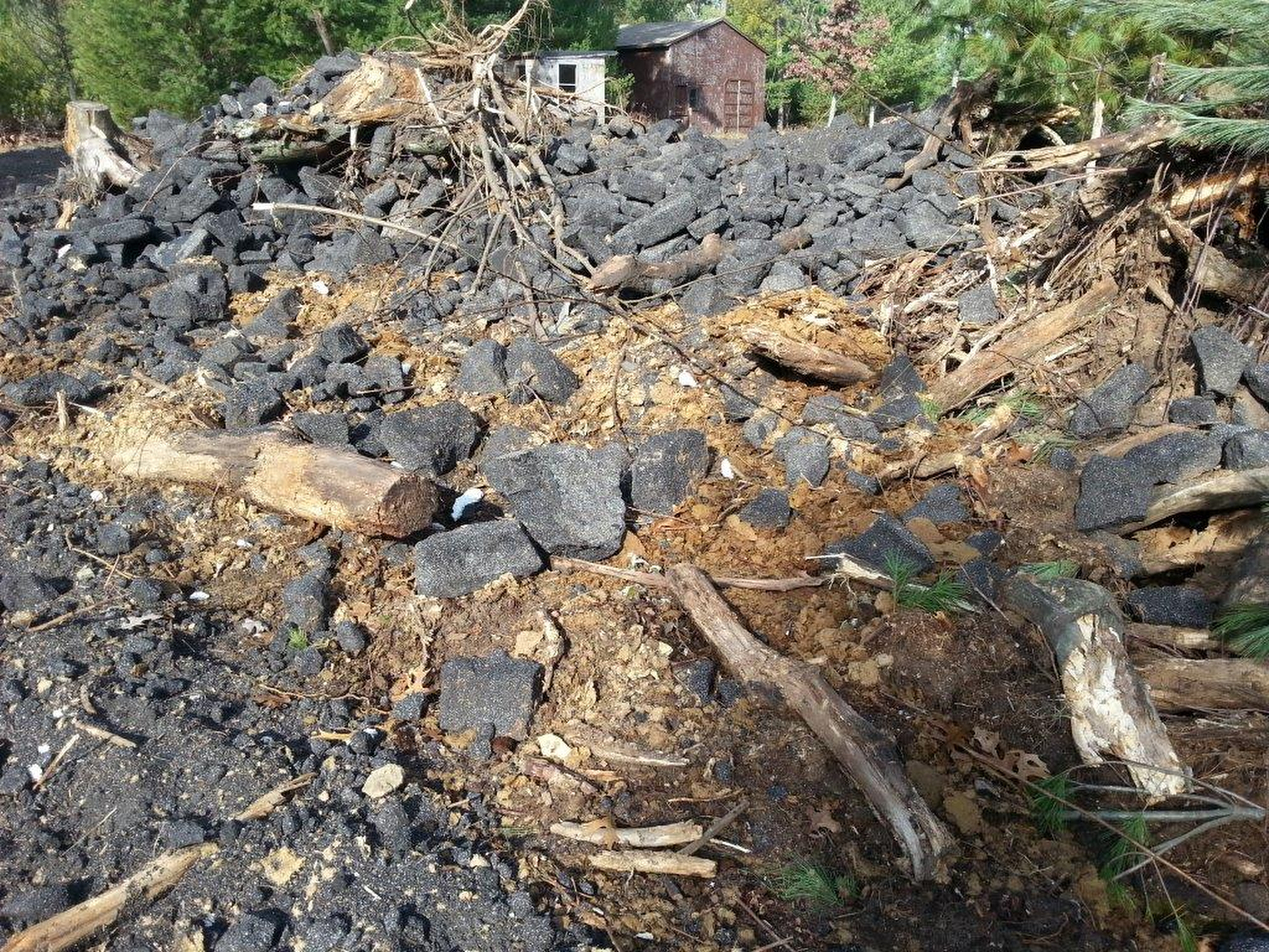 Roofing material is piled up on the Elk Avenue property in Adams County during a DNR inspection in 2015