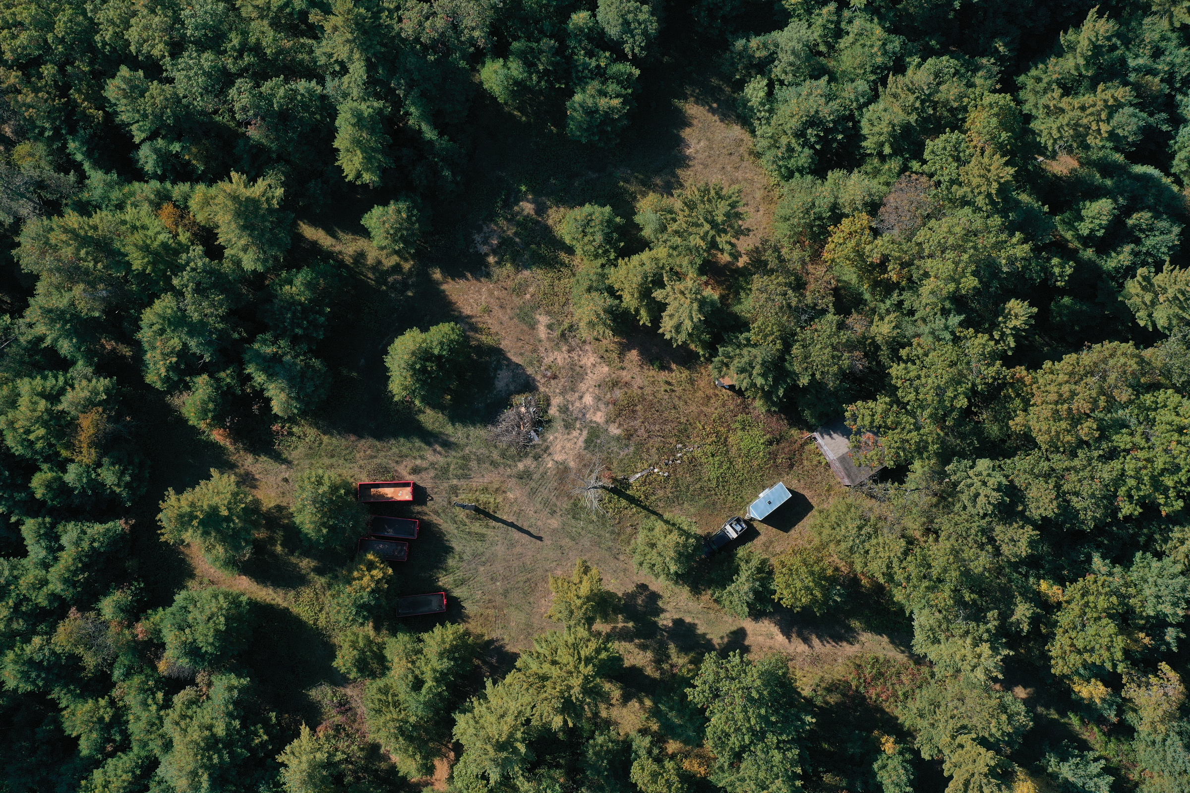 Aerial view of Zach Skrede's property showing an open field surrounded by woods