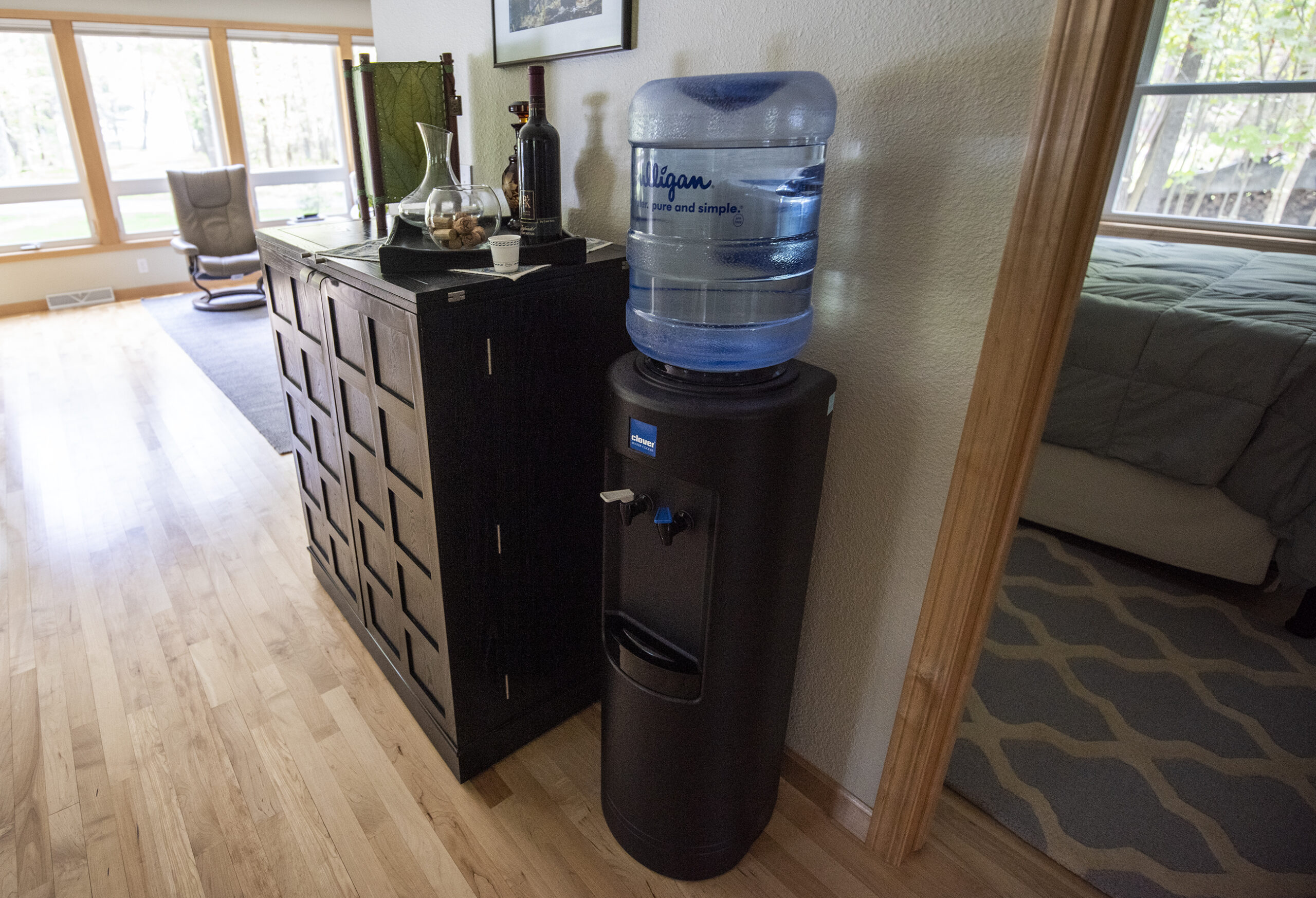 A Culligan water dispenser system is set up in a home.