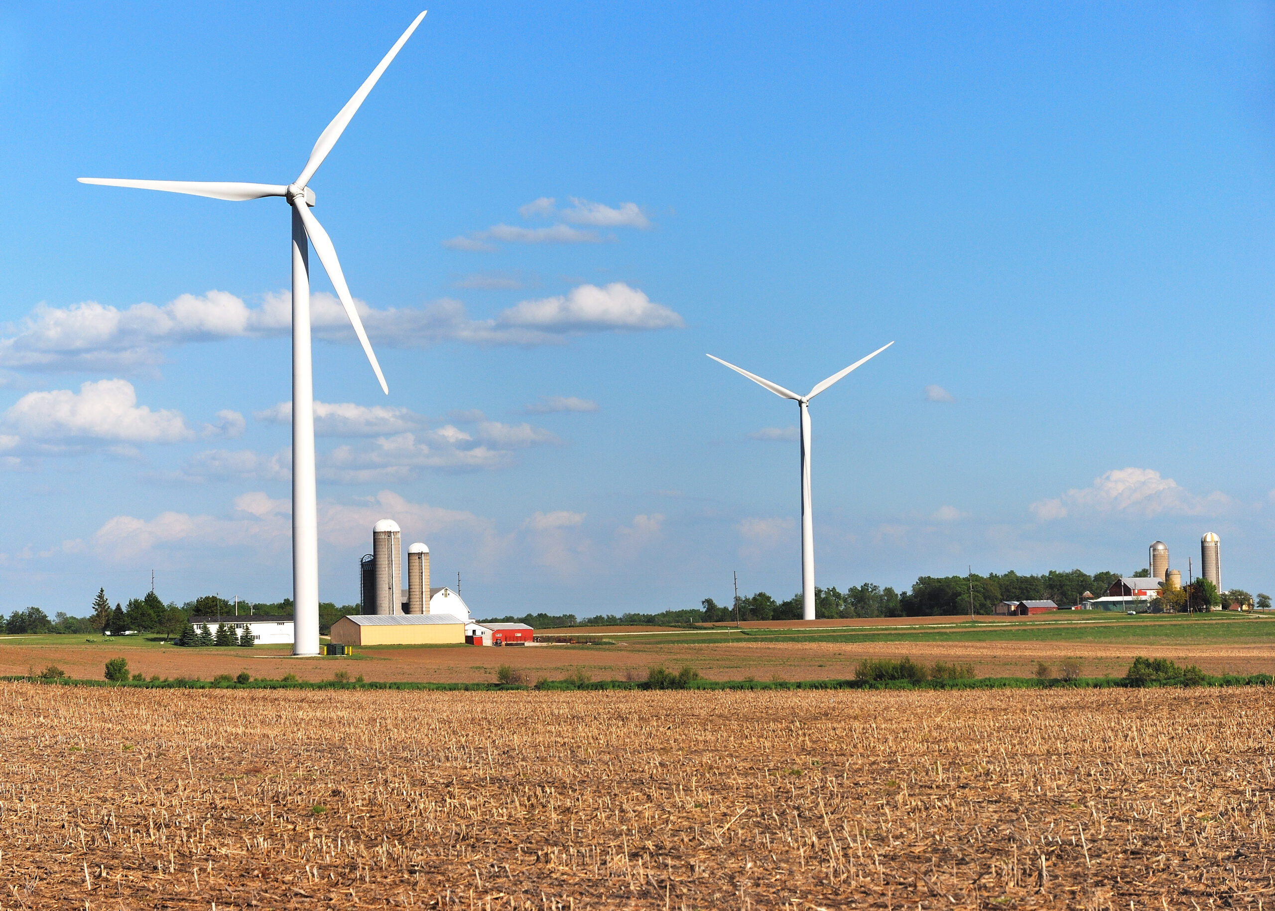Wind turbines near farms