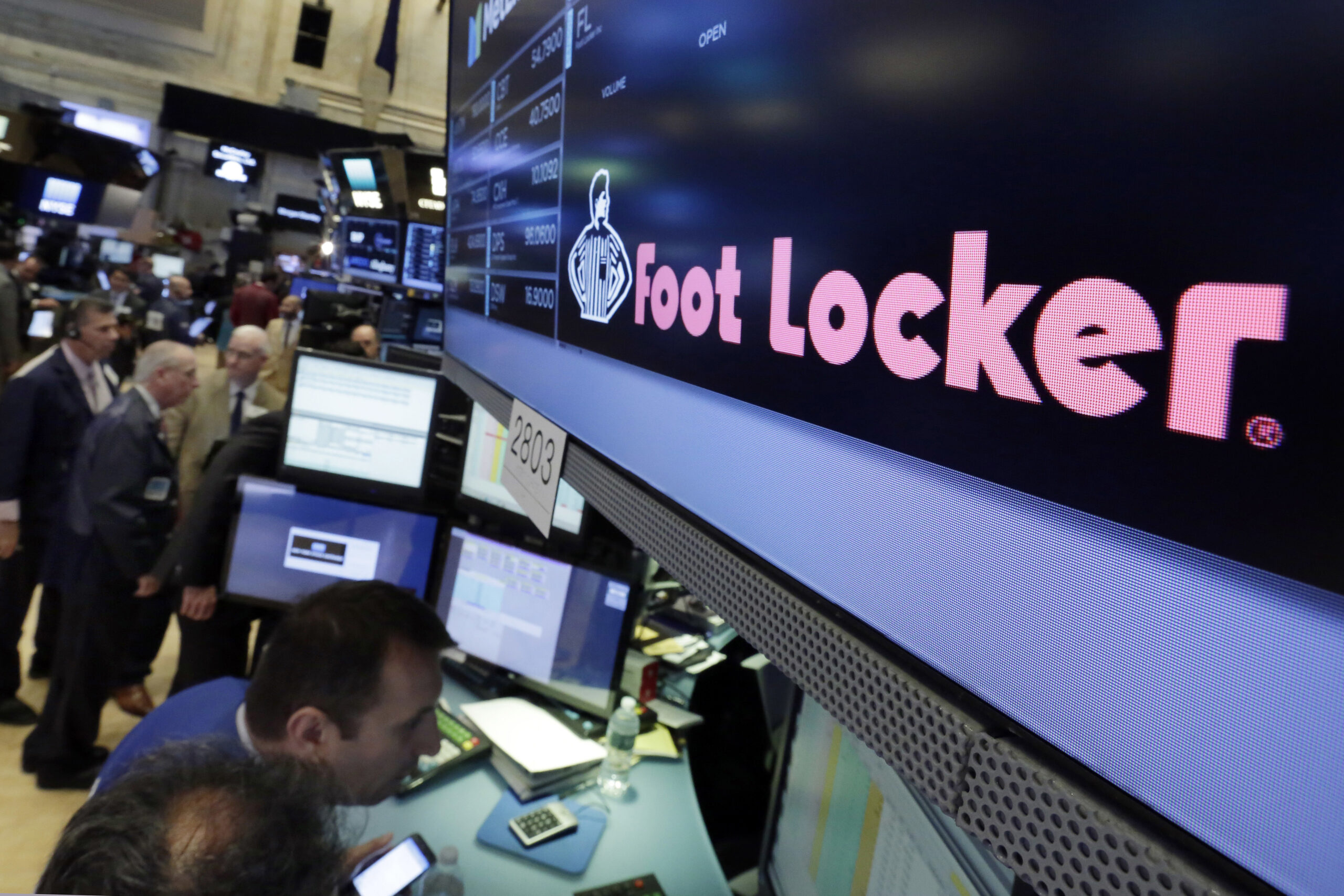 The Foot Locker logo appears above a trading post on the floor of the New York Stock Exchange.
