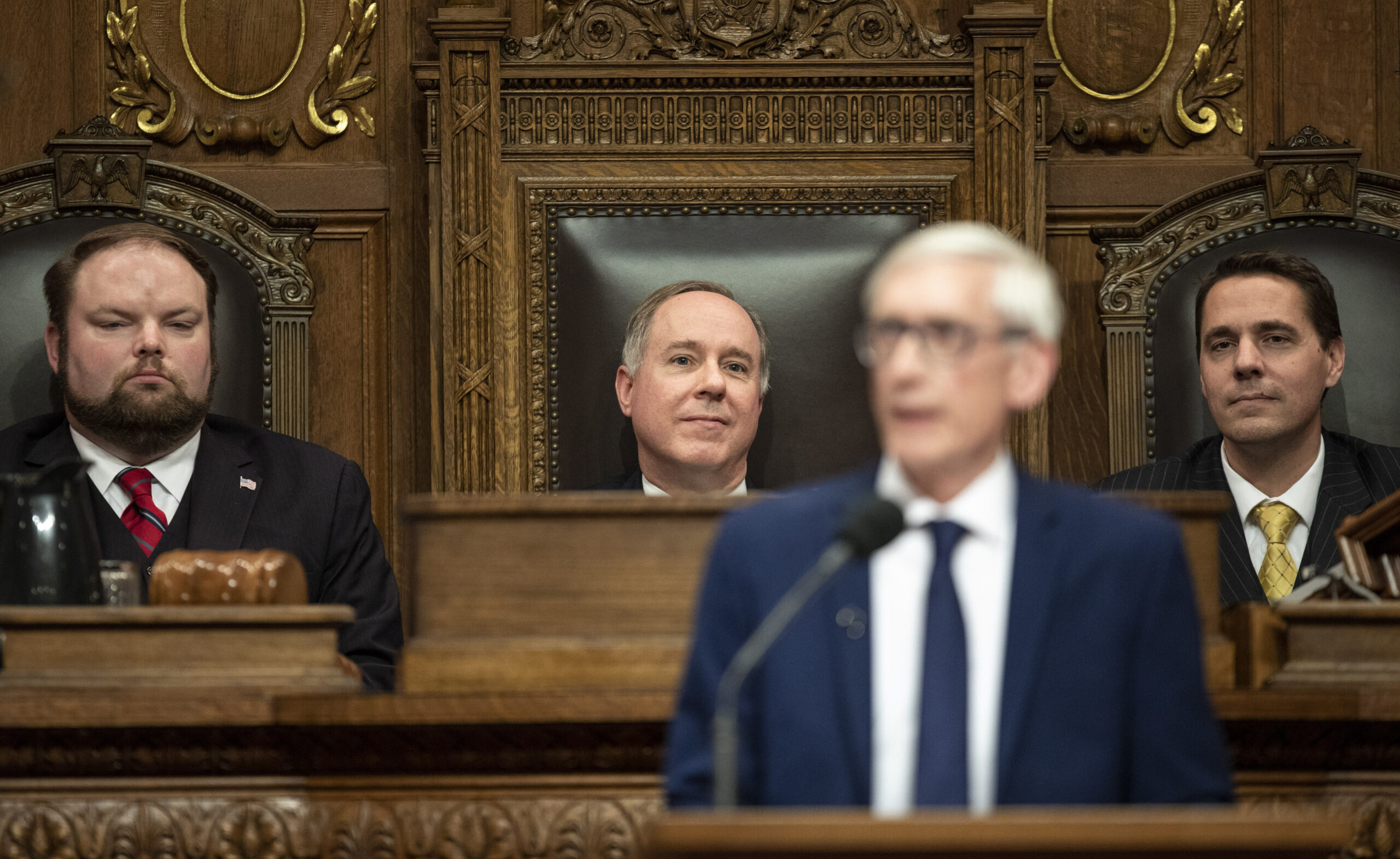 Assembly Speaker Robin Vos listening to Gov. Tony Evers address