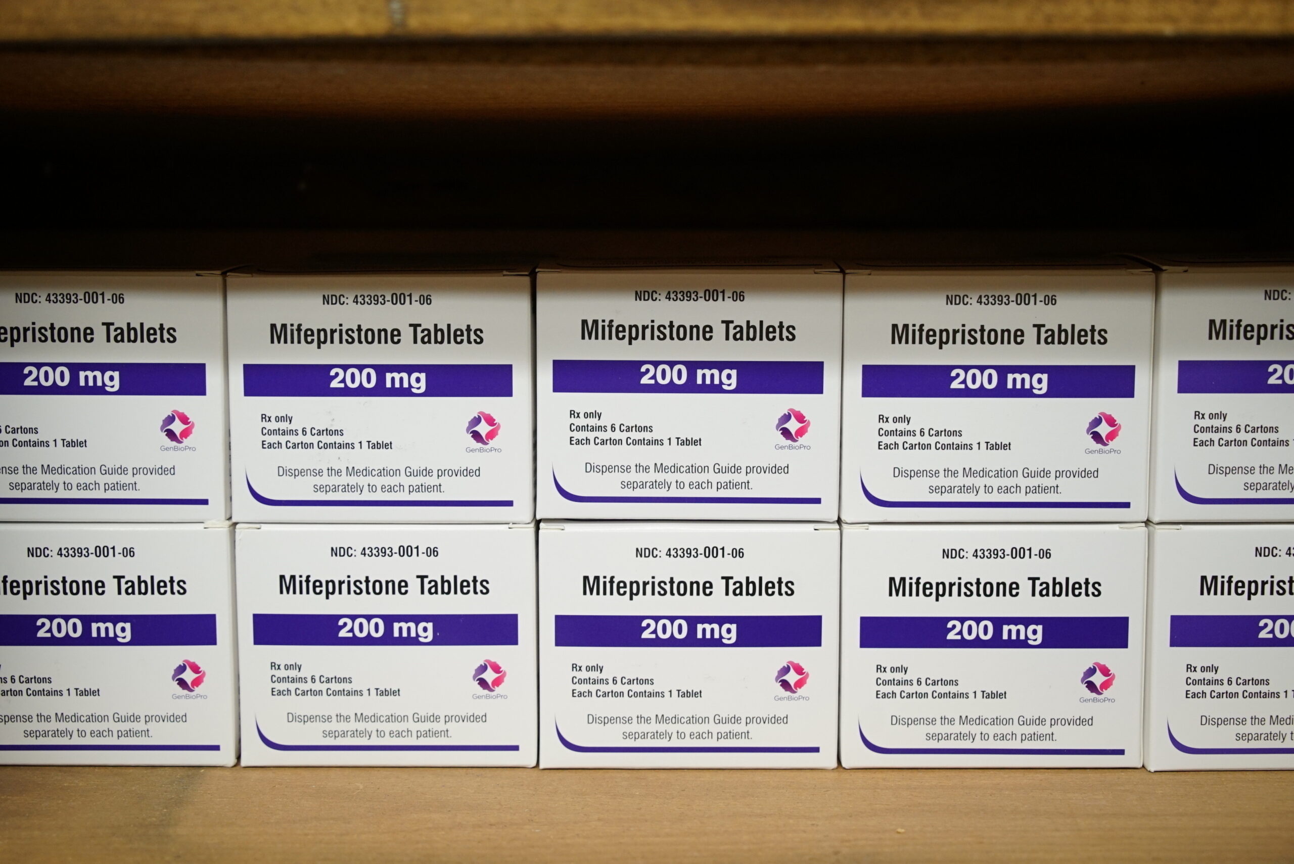 Boxes of the drug mifepristone line a shelf.