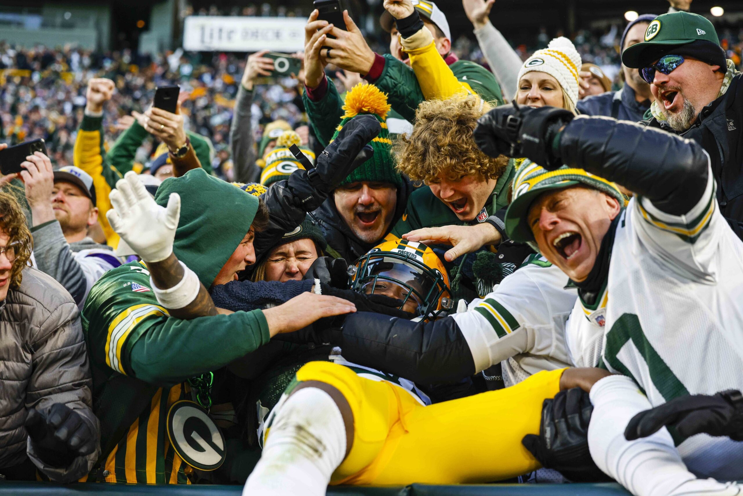 Green Bay Packers safety Darnell Savage does a Lambeau leap.