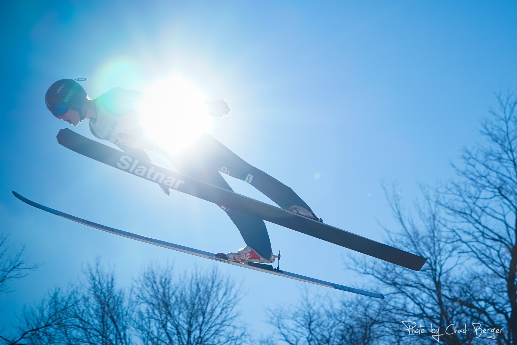 Nejc Toporis from team Slovenia is pictured silhouetted against the sun during a ski jumping competition in Westby, Wisconsin.