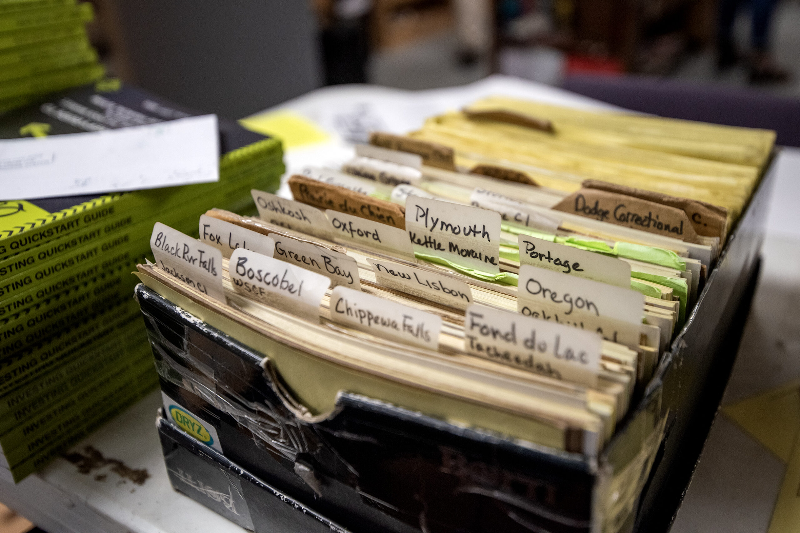 A box with file tabs and papers.