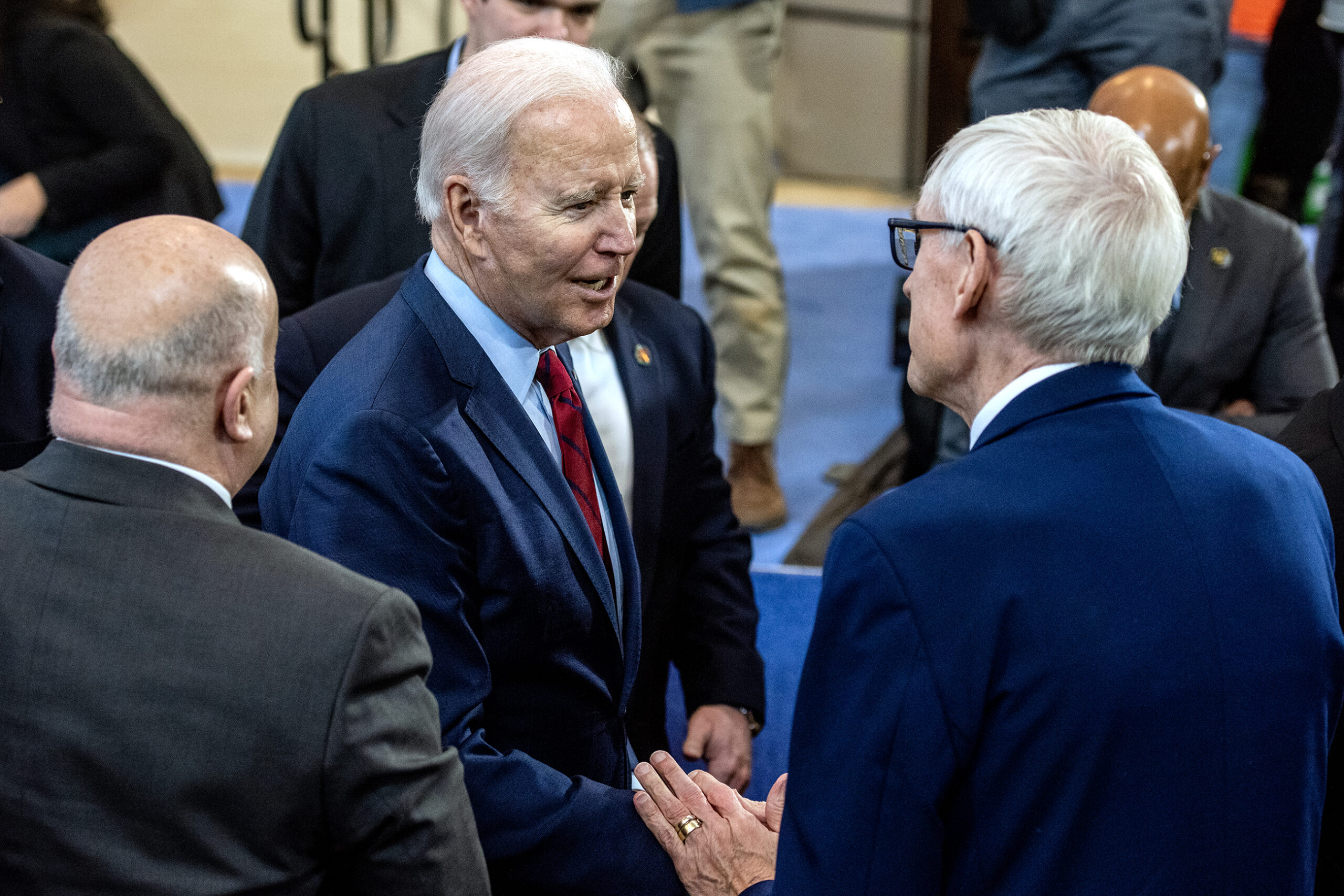 President Joe Biden shakes hands with Gov. Tony Evers.