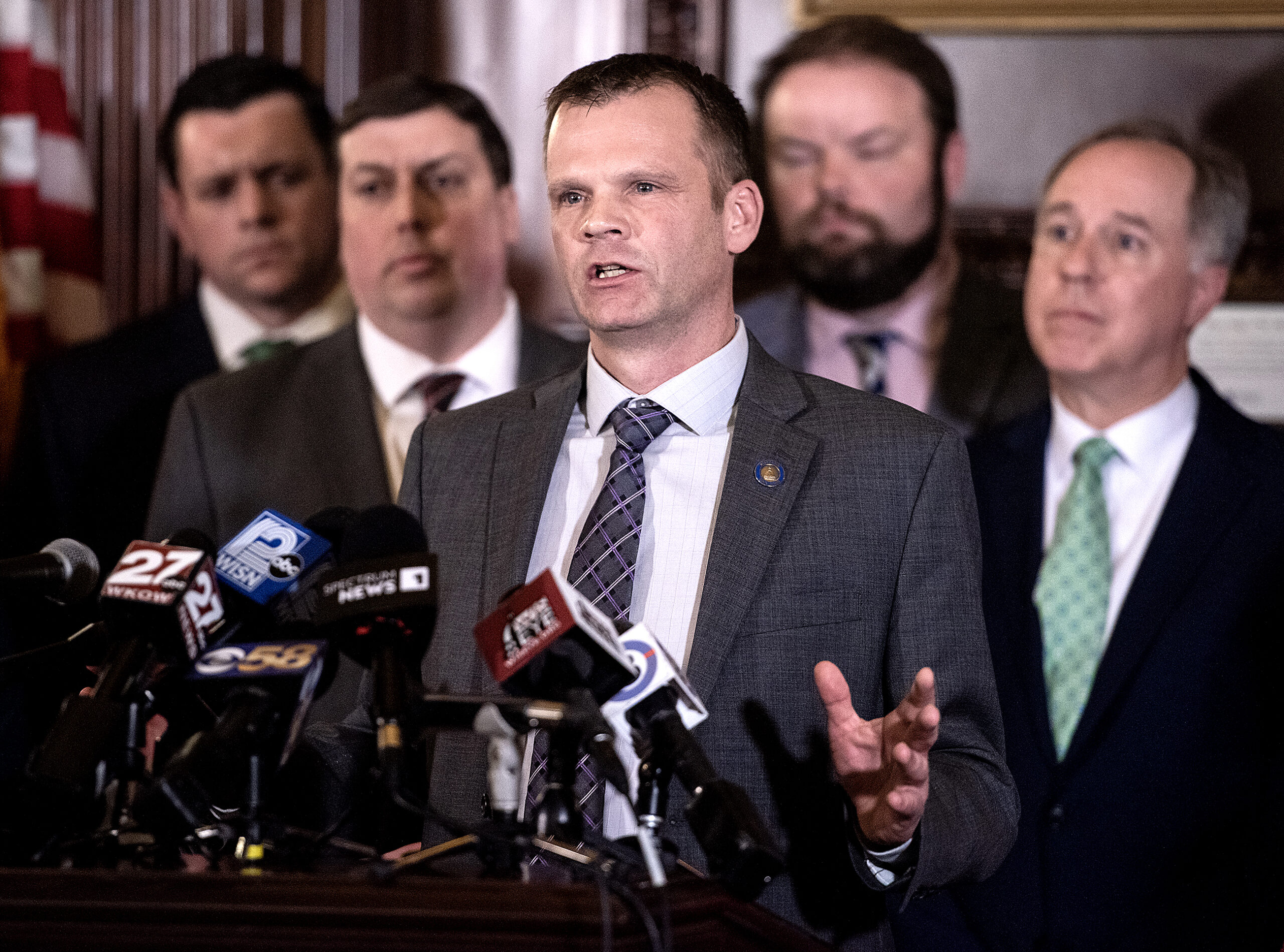 Senator Devin LeMahieu stands with other legislators during a press conference.