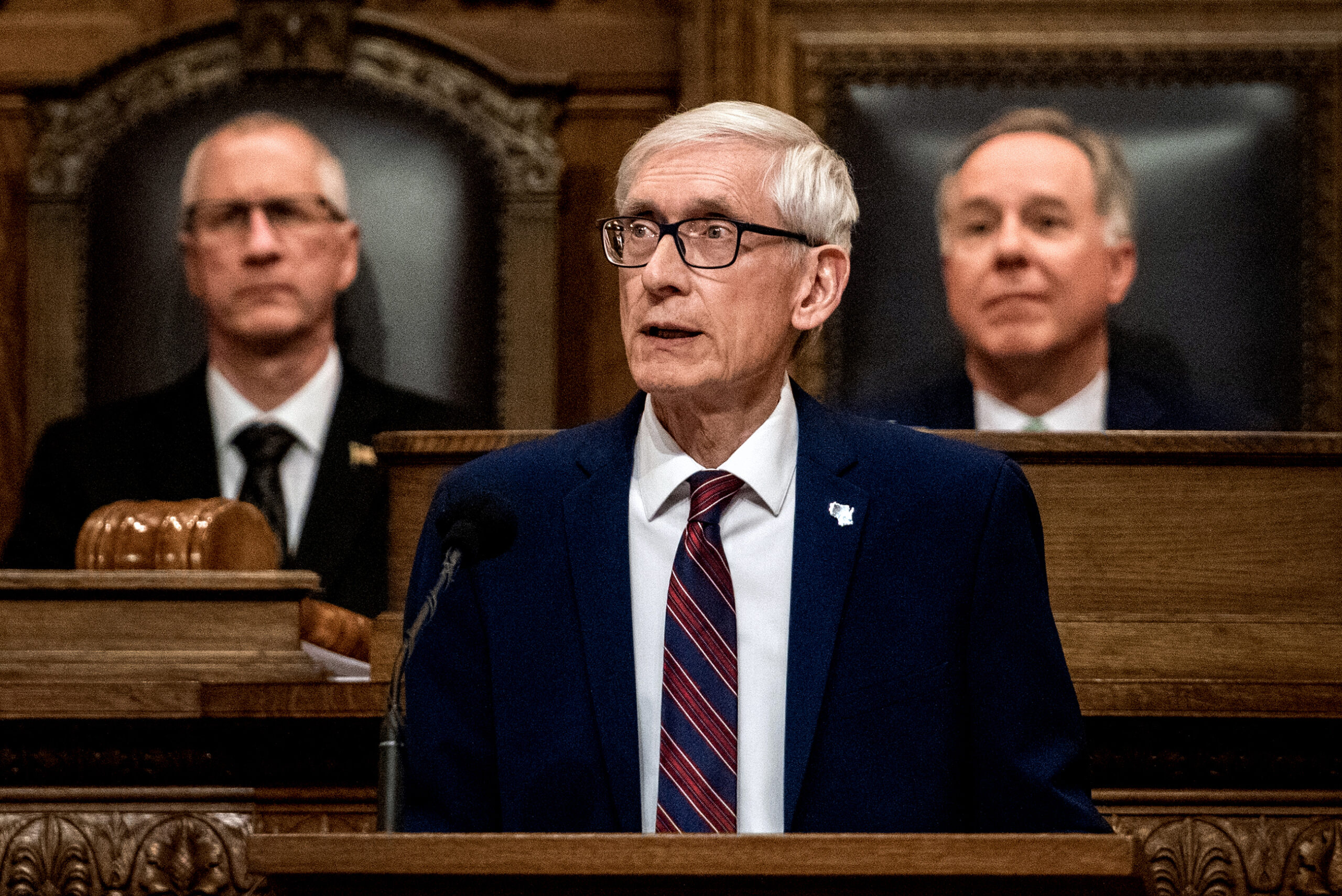 Gov. Tony Evers stands in front of the assembly and gives a speech.